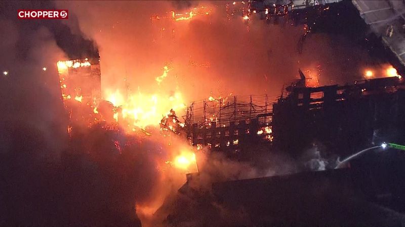 Crews battle a large fire at an apartment building under construction near 1040 East and 2220 South in Salt Lake City on Oct. 25, 2022.