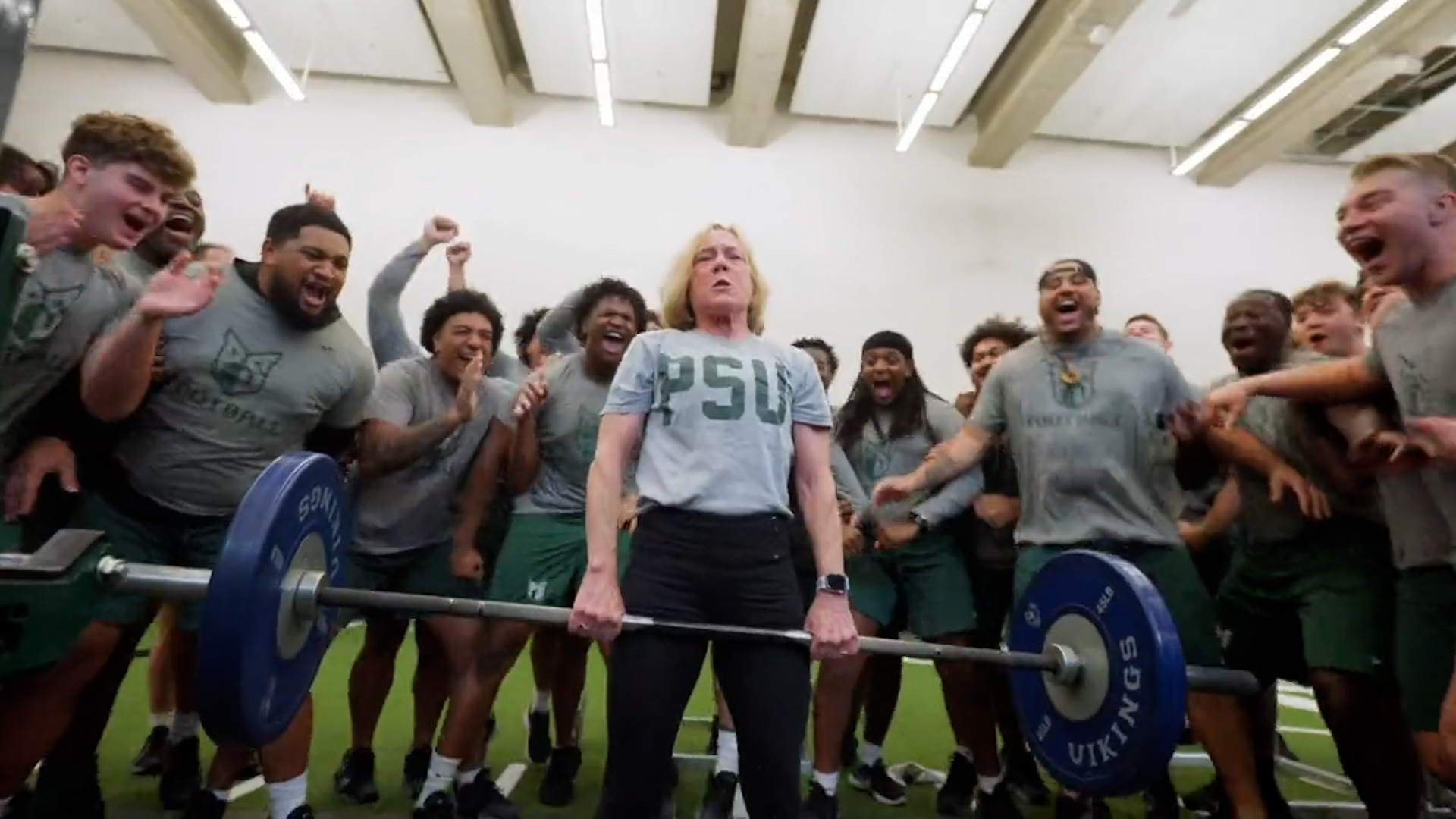 Portland State University president Ann Cudd participates in football workouts for a video previewing their game against Eastern Washington.