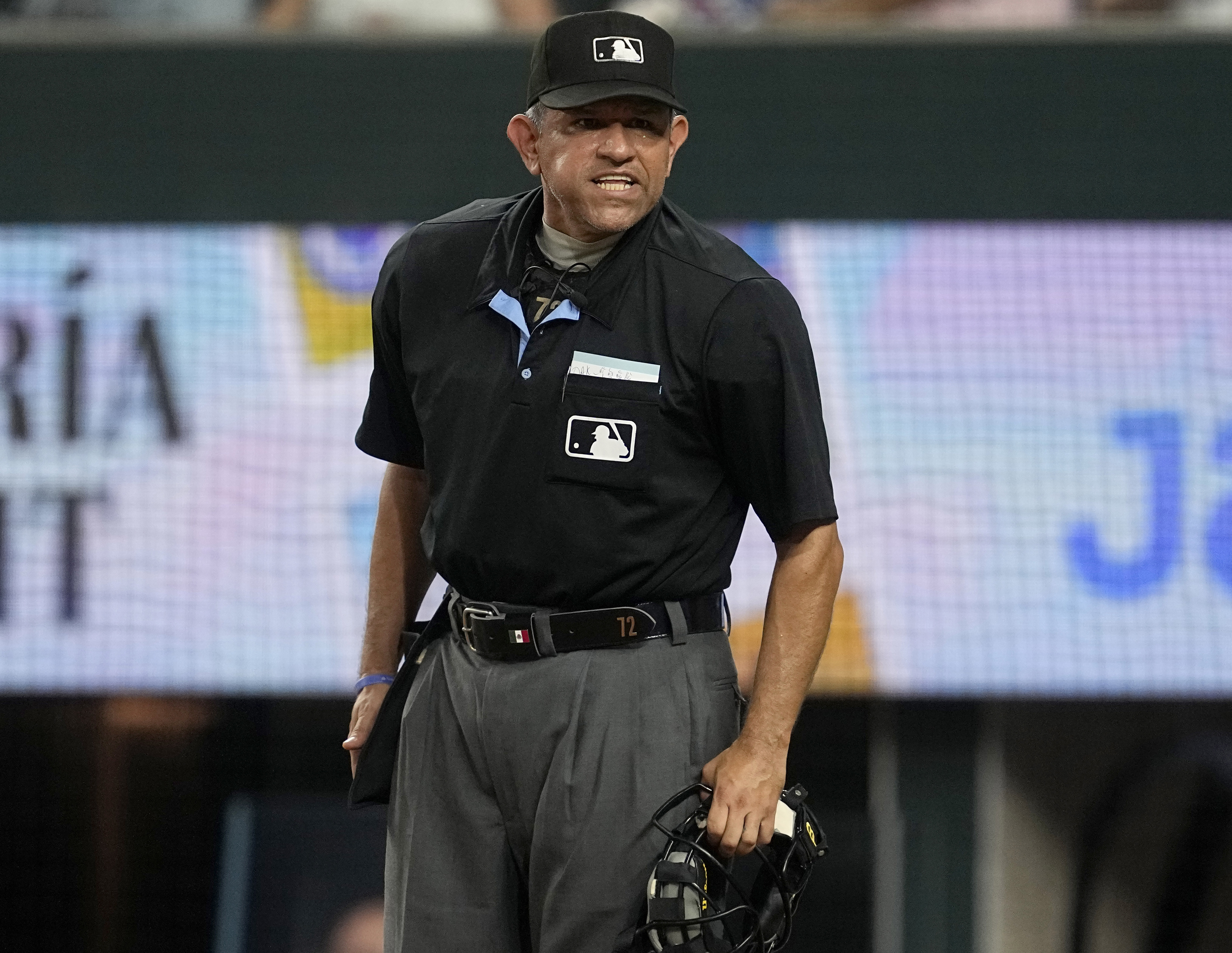 Home plate umpire Alfonso Marquez shouts instructions to the Oakland Athletics dugout during a baseball game against the Texas Rangers, Sept. 9, 2023, in Arlington, Texas. Alfonso Marquez and Bill Miller will be joined by five first-time World Series umpires when the Texas Rangers play the Arizona Diamondbacks starting Friday night, Oct. 27, 2023. 