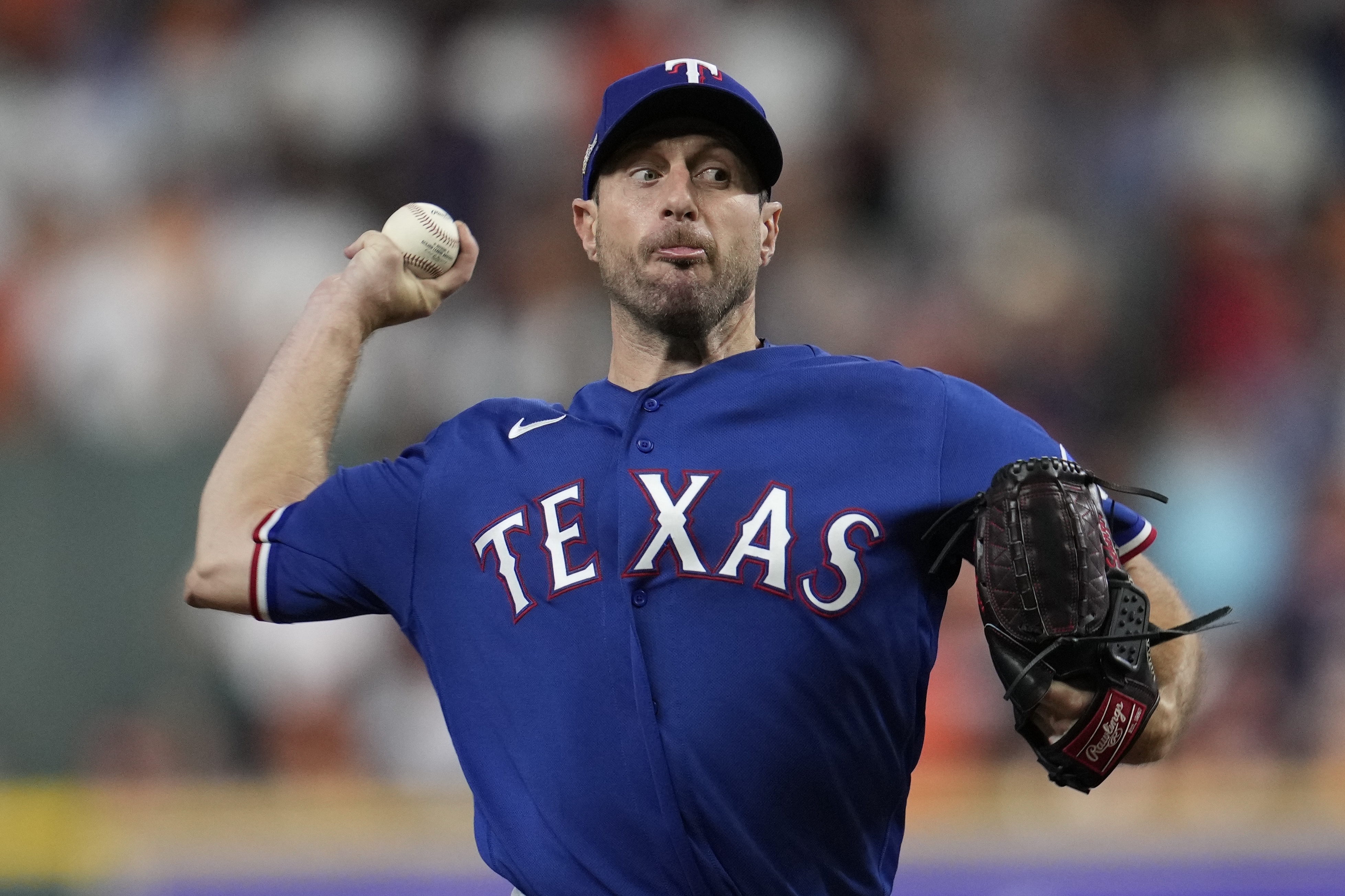 Texas Rangers starter Max Scherzer throws during the first inning of Game 7 of the baseball AL Championship Series against the Houston Astros Monday, Oct. 23, 2023, in Houston. 