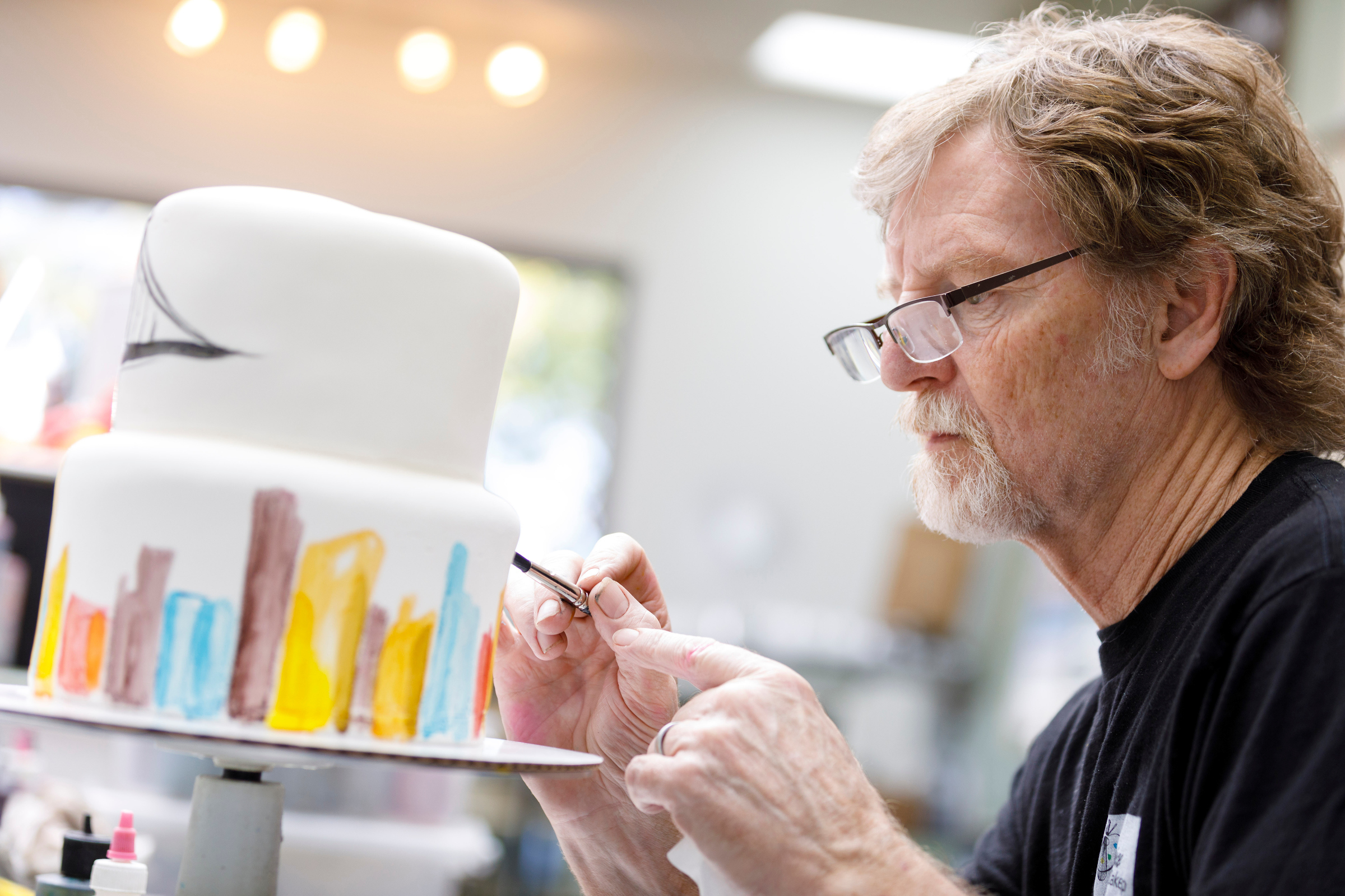 Jack Phillips, owner of Masterpiece Cakeshop in Lakewood, Colorado, decorates a cake for a client on Sept. 21, 2017.