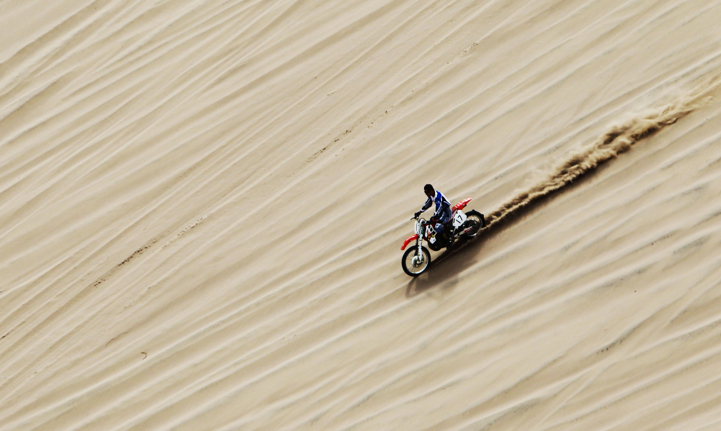 A person rides an off-road vehicle at Little Sahara Recreation Area in Juab County, on Sept. 14, 2011. Young Powersports — Utah's largest powersports dealership — is hosting a grand opening celebration for the company's Centerville location.