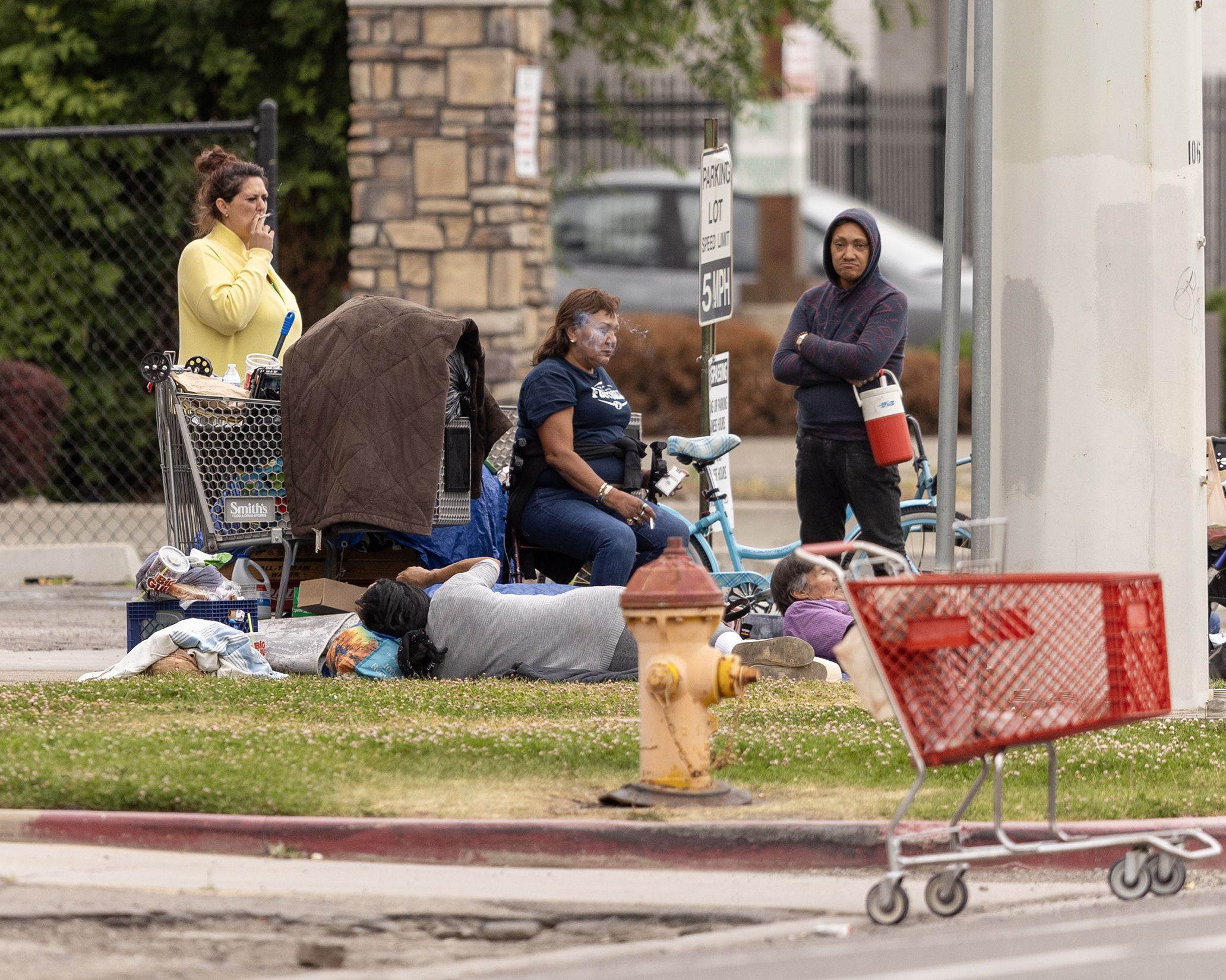 Homeless people sit or walk around small campsites in Salt Lake City on June 28. A new Deseret News/Hinckley Institute of Politics poll says 22% oppose the policy, which Salt Lake City officials say would be safer than unsanctioned camping.