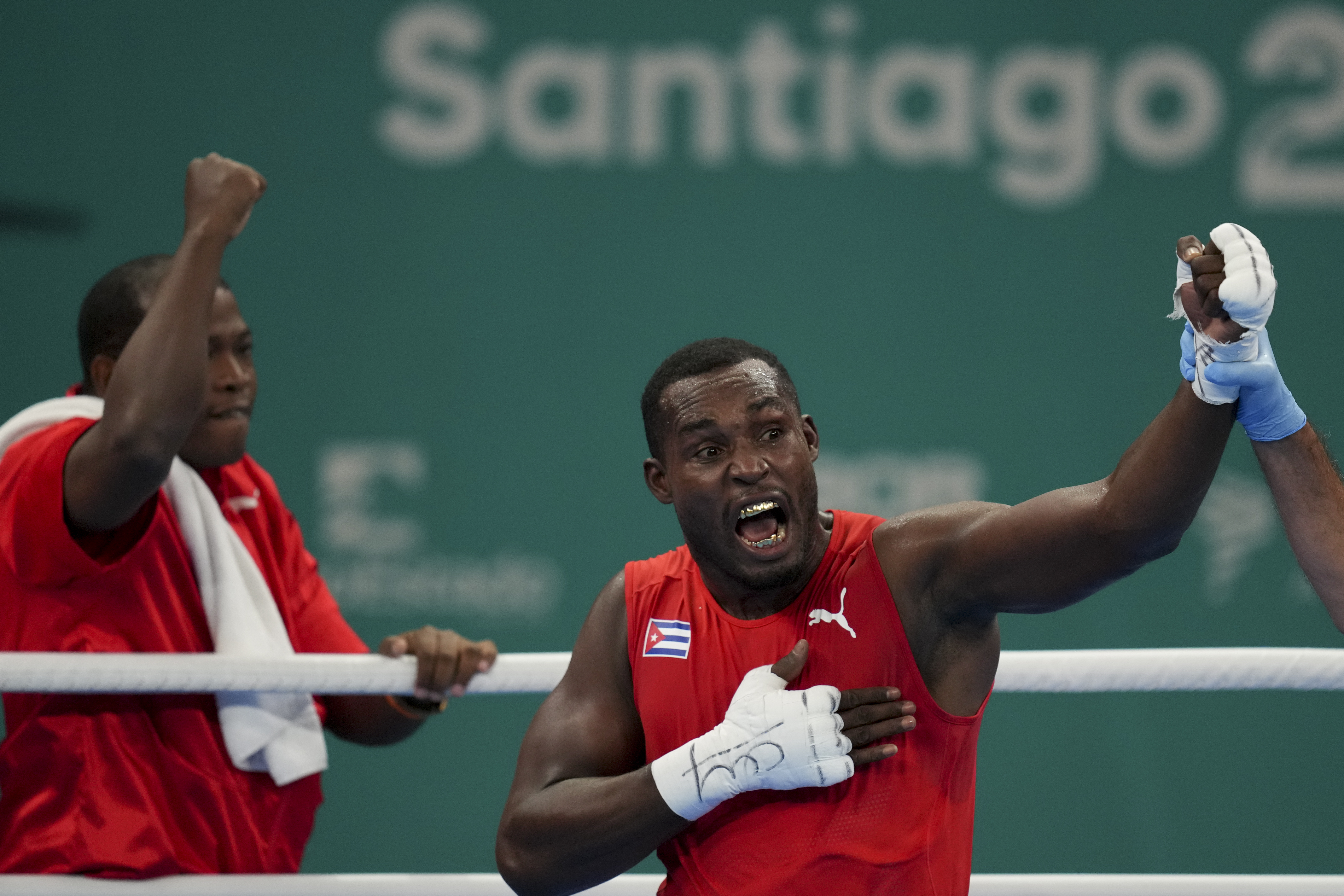 Cuba's Julio La Cruz celebrates beating Brazil's Keno Machado in the men's boxing 92kg final bout at the Pan American Games in Santiago, Chile, Friday, Oct. 27, 2023. 