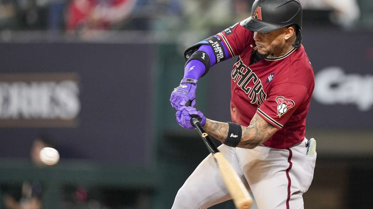 Arizona Diamondbacks' Ketel Marte hits a RBI double off Texas Rangers starting pitcher Nathan Eovaldi during the fifth inning in Game 1 of the baseball World Series Friday, Oct. 27, 2023, in Arlington, Texas.