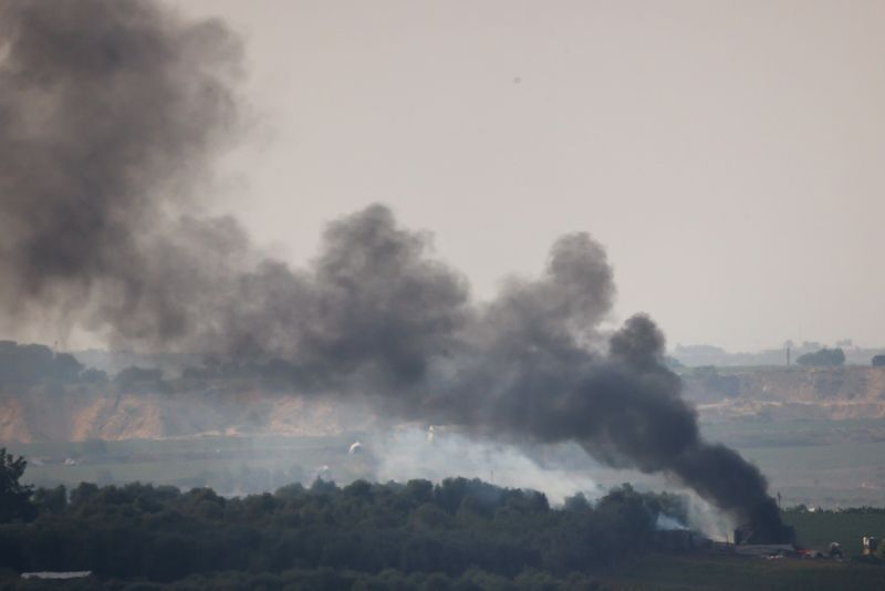Smoke rises over Gaza, as seen from Israel's border with Gaza, in southern Israel, Friday.