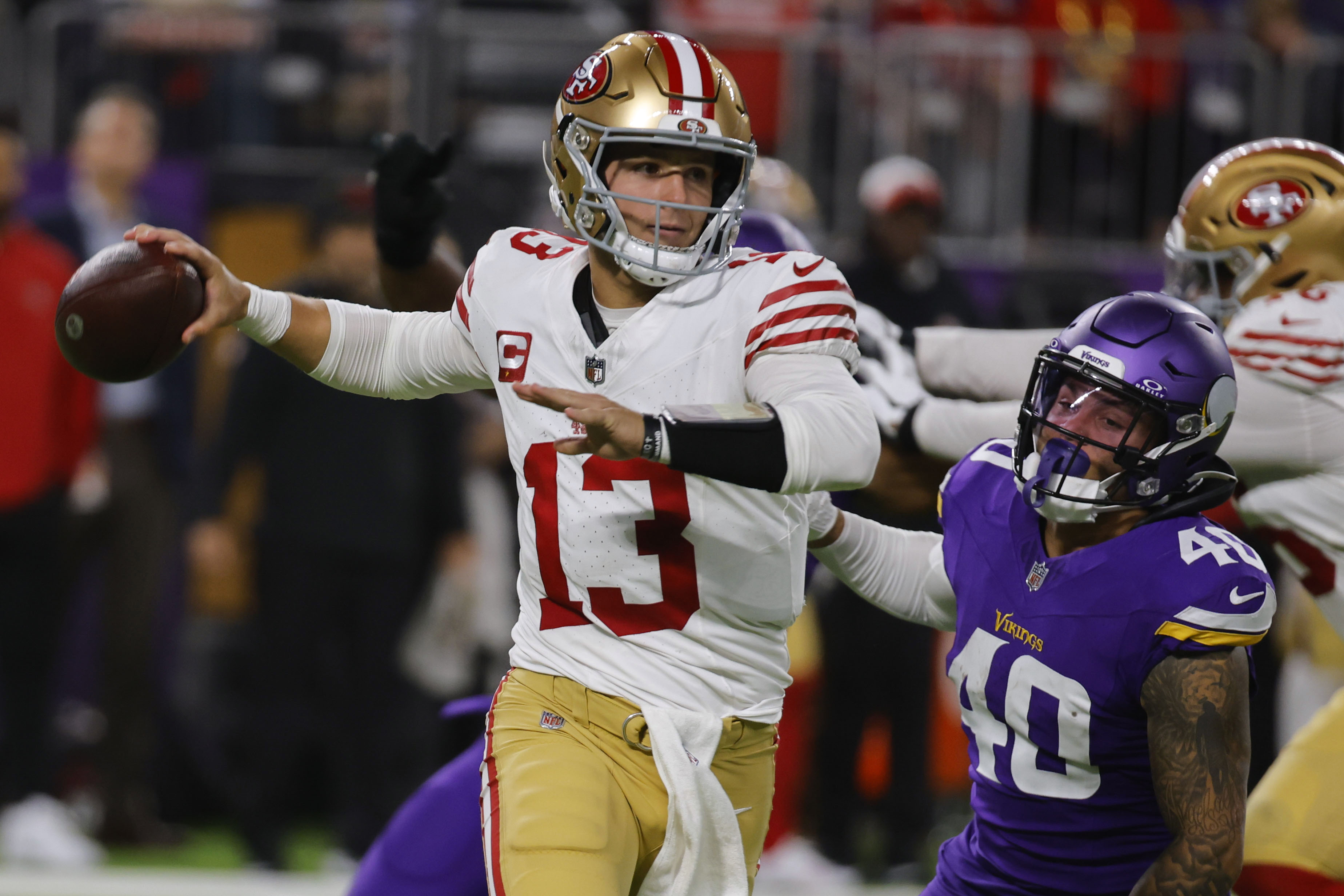 San Francisco 49ers quarterback Brock Purdy (13) is pressured by Minnesota Vikings linebacker Ivan Pace Jr. (40) during the second half of an NFL football game, Monday, Oct. 23, 2023, in Minneapolis.
