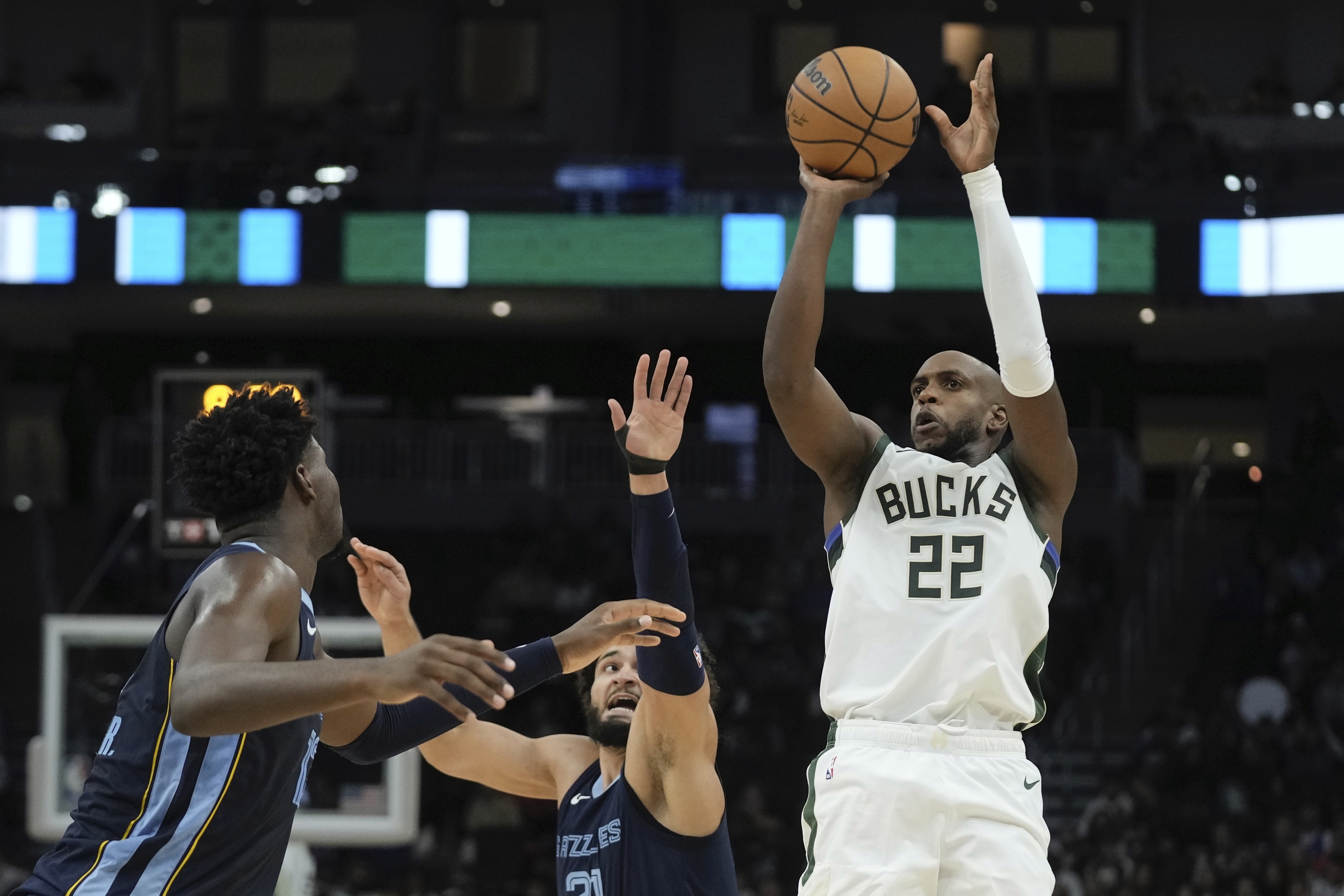 Milwaukee Bucks' Khris Middleton shoots past Memphis Grizzlies' David Roddy during the first half of a preseason NBA basketball game Friday, Oct. 20, 2023, in Milwaukee. 