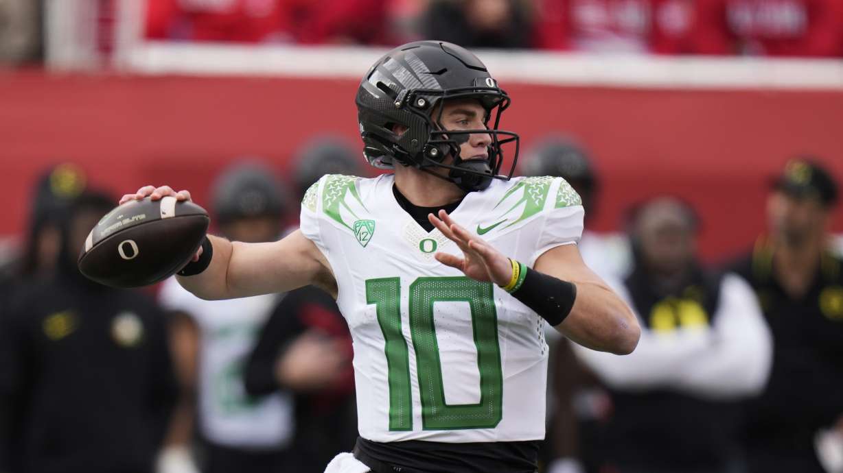 Oregon quarterback Bo Nix (10) throws during the first half of an NCAA college football game against Utah Saturday, Oct. 28, 2023, in Salt Lake City.