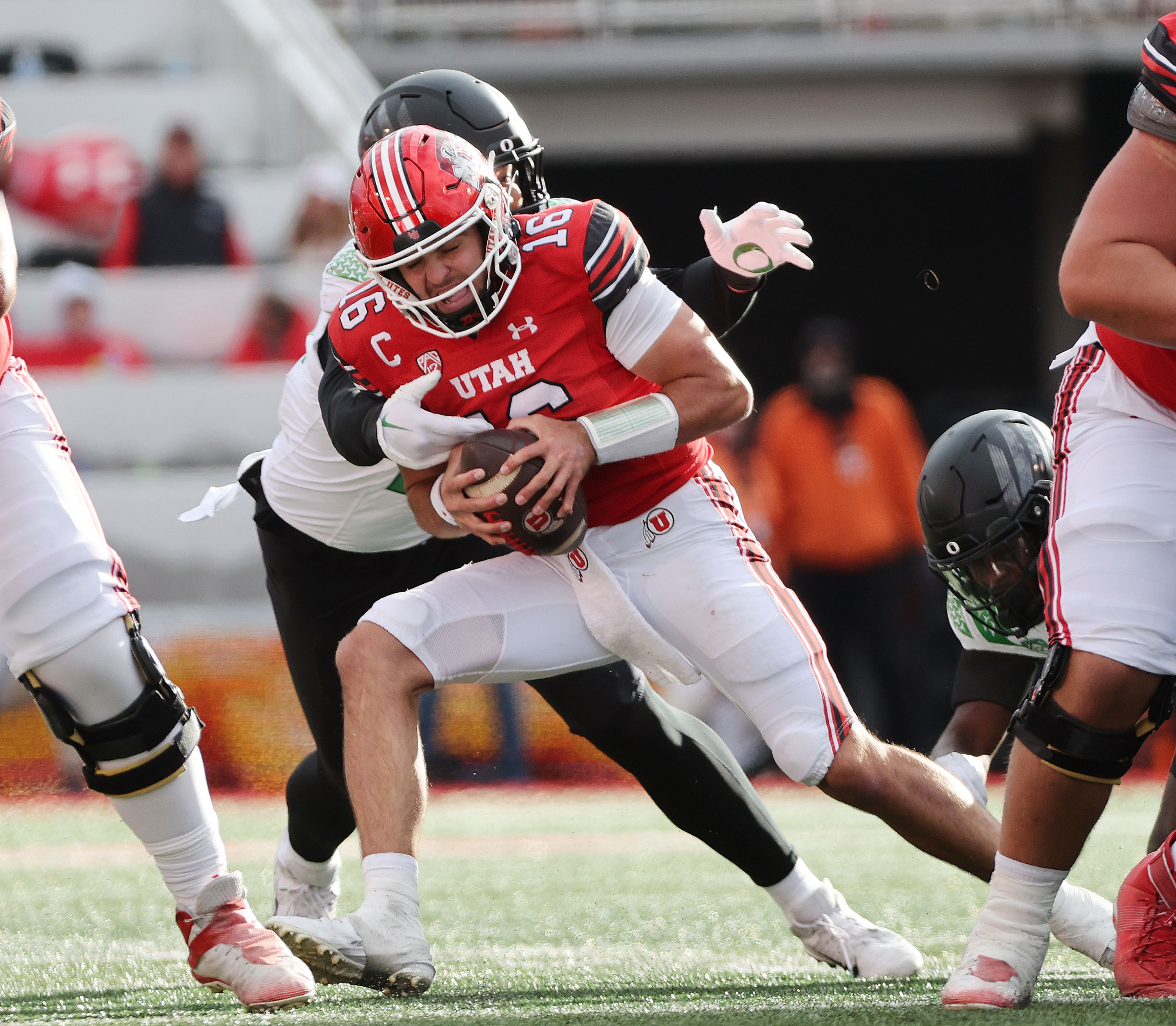 Utah Utes quarterback Bryson Barnes (16) is hurried by Oregon Ducks defensive end Matayo Uiagalelei (10)  in Salt Lake City on Saturday, Oct. 28, 2023. Oregon won 35-6.