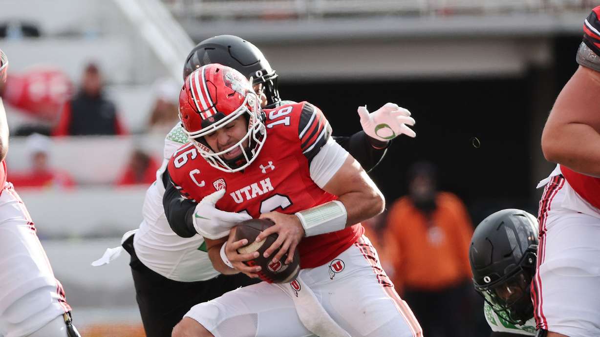 Utah Utes quarterback Bryson Barnes (16) is hurried by Oregon Ducks defensive end Matayo Uiagalelei (10) in Salt Lake City on Saturday, Oct. 28, 2023. Oregon won 35-6.