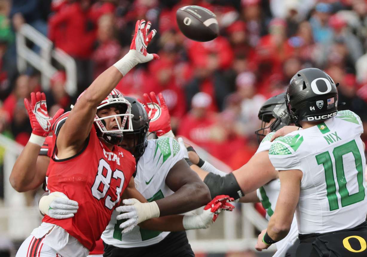 Utah Utes defensive end Jonah Elliss (83) tries to block a pass by Oregon Ducks quarterback Bo Nix (10) in Salt Lake City on Saturday, Oct. 28, 2023. Oregon won 35-6.