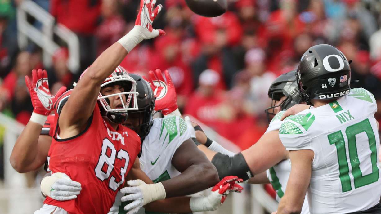 Utah Utes defensive end Jonah Elliss (83) tries to block a pass by Oregon Ducks quarterback Bo Nix (10) in Salt Lake City on Saturday, Oct. 28, 2023. Oregon won 35-6.