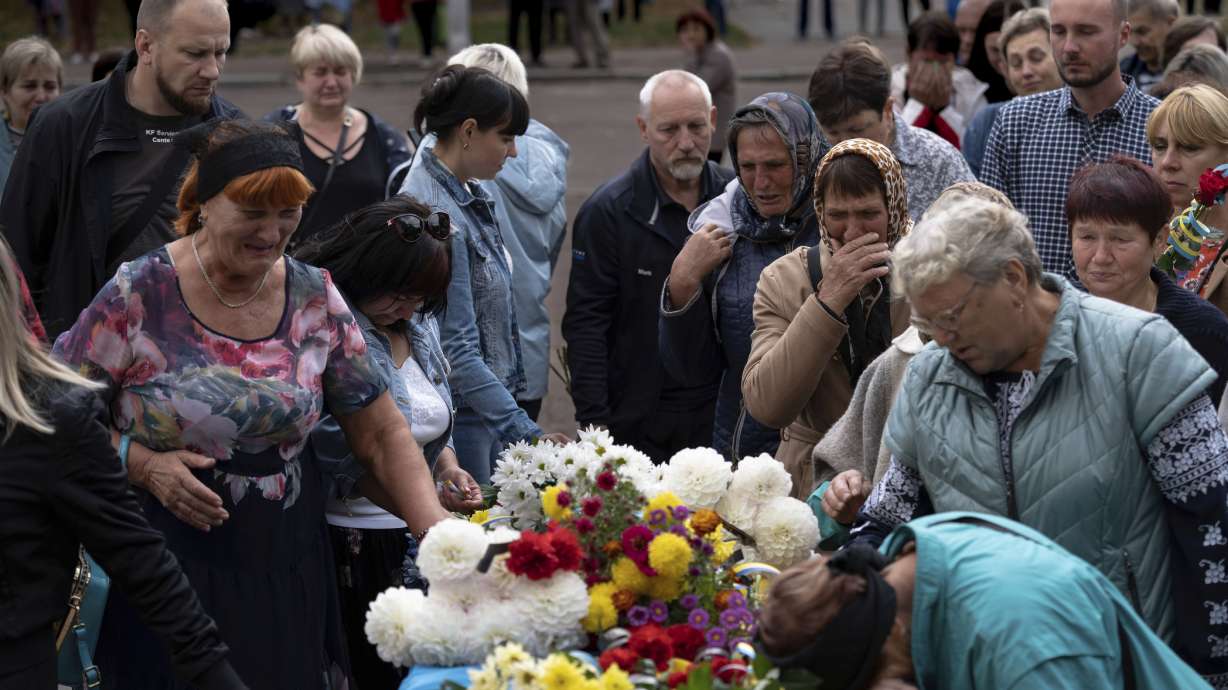 Local residents come to pay their respects to a Ukrainian soldier, Andrii “Adam” Grinchenko of the 3rd Assault Brigade, who was injured in the battle for Andriivka during a funeral ceremony in Shostka, Sumy region, Ukraine, on Tuesday. Hundreds of people came to say goodbye to the 31-year-old Grinchenko in his hometown of Shostka.