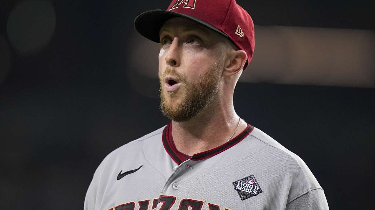 Arizona Diamondbacks starting pitcher Merrill Kelly reacts to the end of the sixth inning in Game 2 of the baseball World Series against the Texas Rangers Saturday, Oct. 28, 2023, in Arlington, Texas.