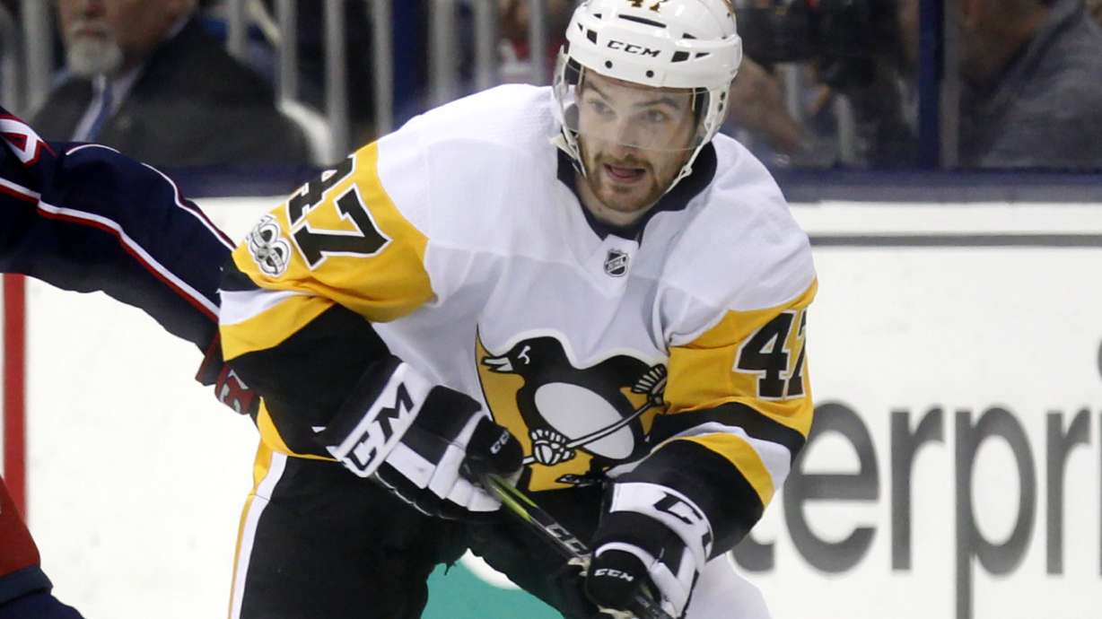 FILE - Pittsburgh Penguins forward Adam Johnson in action during an NHL hockey game in Columbus, Ohio, Friday, Sept. 22, 2017. American hockey player Adam Johnson has died after a “freak accident” during a game in England on Saturday, Oct. 28, 2023 his club said. The 29-year-old Minnesota native was playing for the Nottingham Panthers in a Challenge Cup game against the Sheffield Steelers when he suffered a slashed neck during the second period of the game at Sheffield’s Utilita Arena.