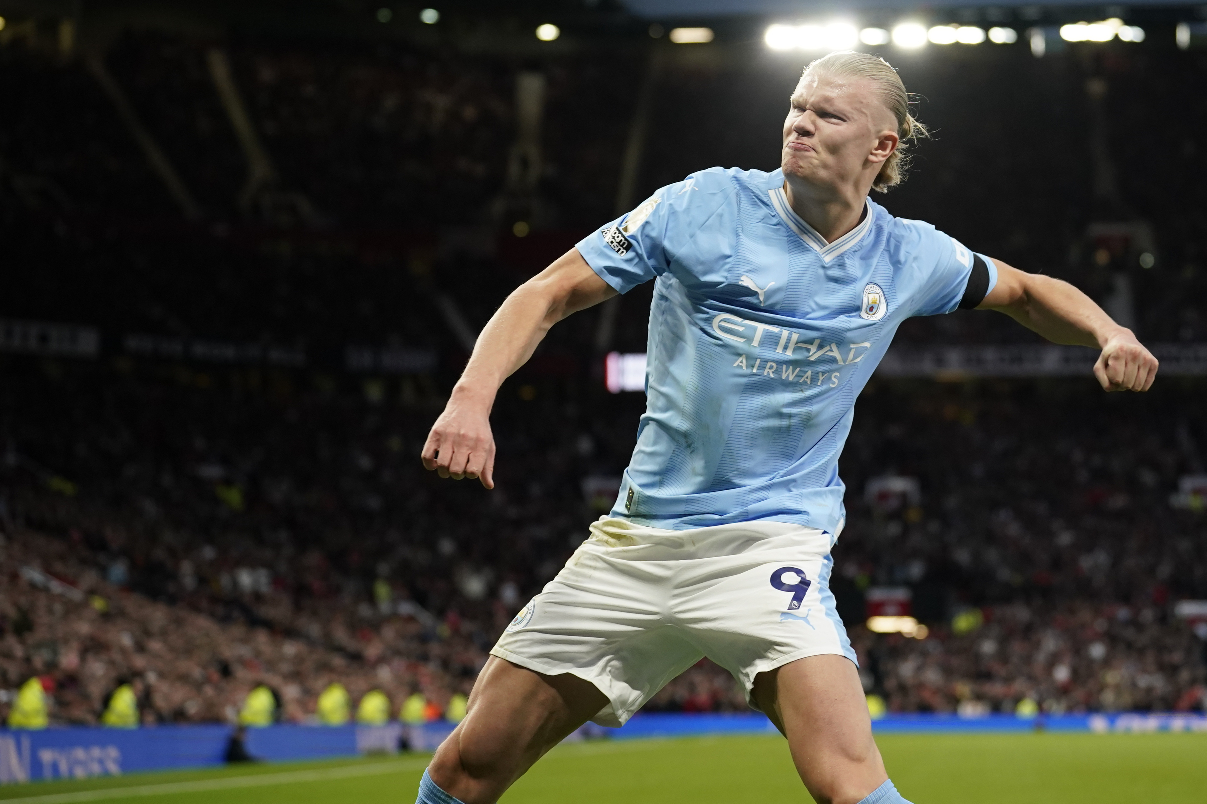 Manchester City's Erling Haaland celebrates after scoring his side's opening goal from a penalty kick during the English Premier League soccer match between Manchester United and Manchester City at Old Trafford stadium in Manchester, England, Sunday, Oct. 29, 2023. 