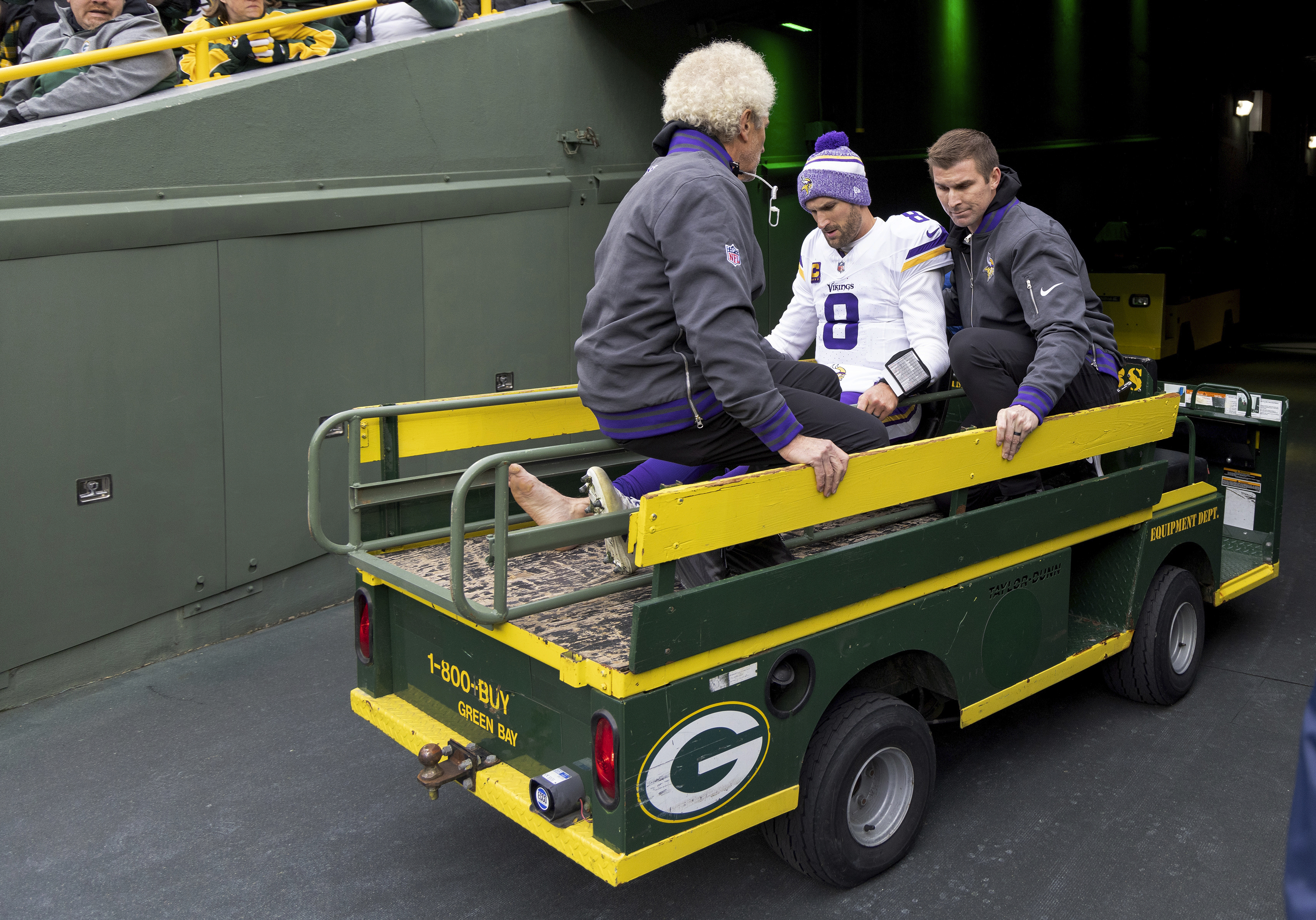 Minnesota Vikings quarterback Kirk Cousins (8) is carted off the field after sustaining an injury during the second half of an NFL football game against the Green Bay Packers, Sunday, Oct. 29, 2023, in Green Bay, Wis.