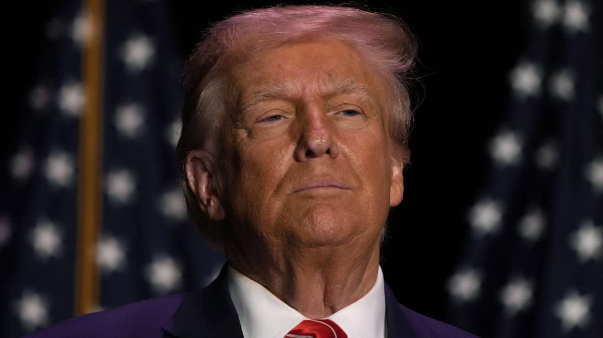 Former President Donald Trump arrives at a commit to caucus rally, Sunday, in Sioux City, Iowa. A judge on Sunday reimposed an order barring Trump from making public comments targeting prosecutors, court staff and potential witnesses.