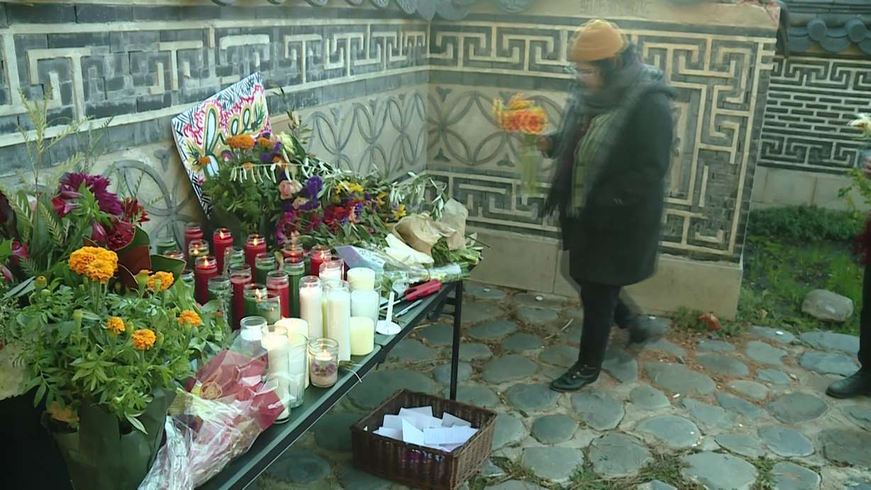 Flowers and candles decorate an altar at the International Peace Gardens in Salt Lake City Sunday, as people gathered to mourn the loss of Palestinian lives in the Israel-Hamas war.