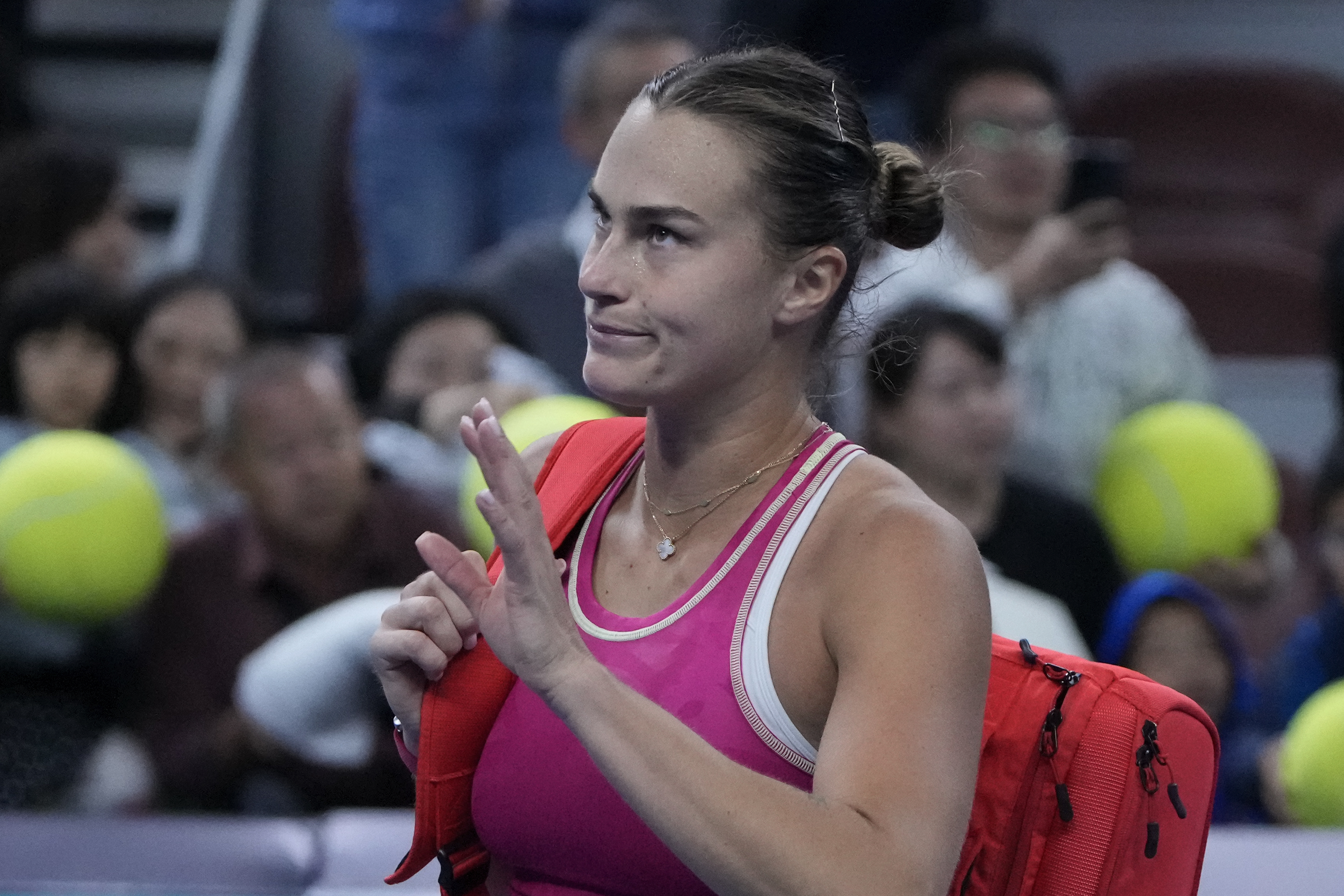 Aryna Sabalenka of Belarus leaves the court after defeated by Elena Rybakina of Kazakhstan in the women's singles quarterfinal match of the China Open tennis tournament at the Diamond Court in Beijing, Friday, Oct. 6, 2023.