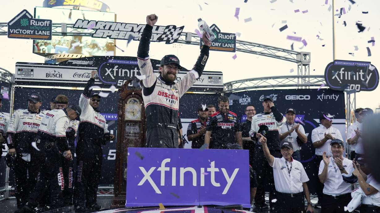 Ryan Blaney celebrates in Victory Lane after winning a NASCAR Cup Series auto race at Martinsville Speedway in Martinsville, Va., Sunday, Oct. 29, 2023.