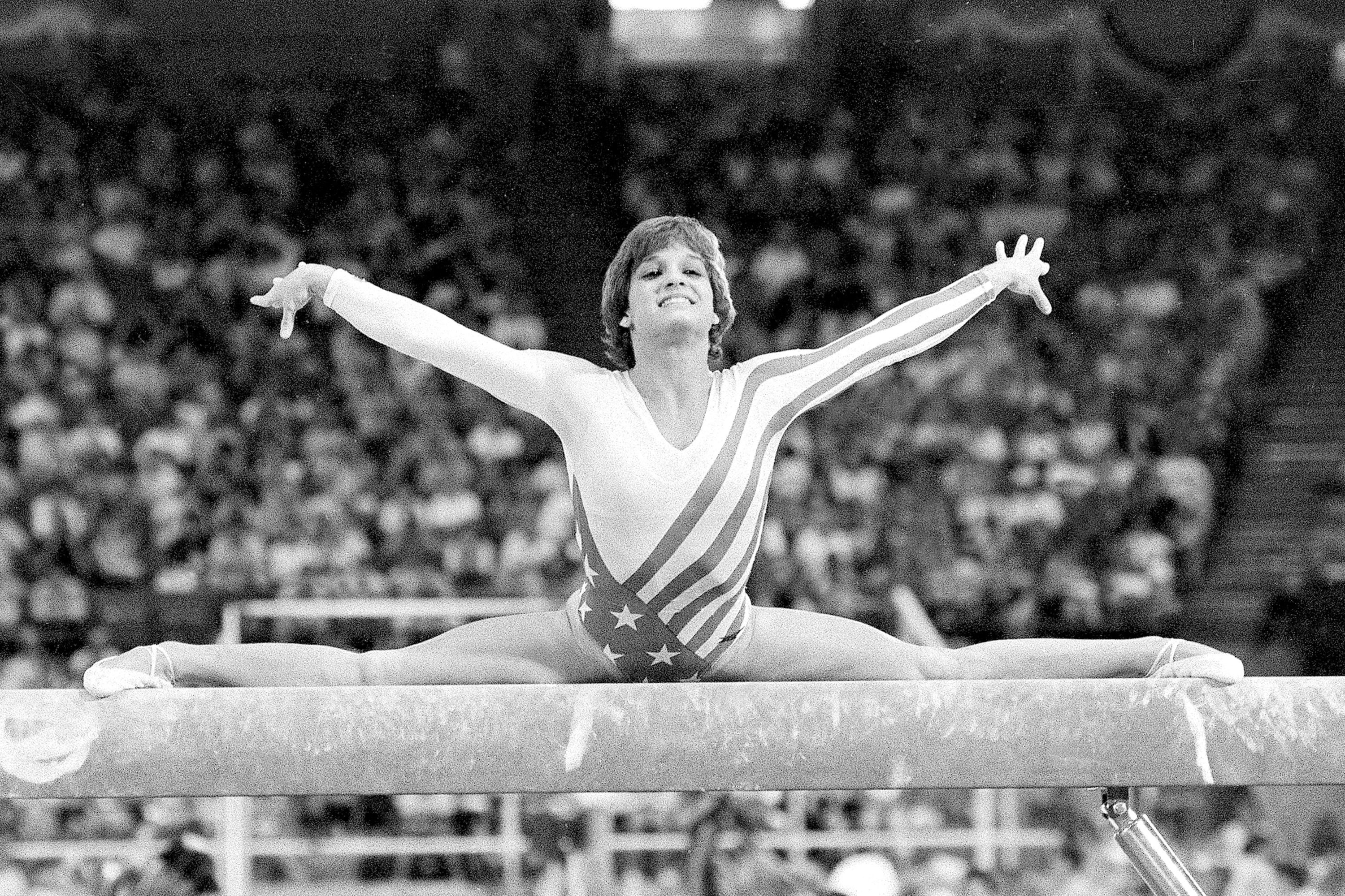 FILE - Mary Lou Retton, of the United States, performs on the balance beam during the women's gymnastics individual all-around finals at the Summer Olympics on Aug. 3, 1984, in Los Angeles. Retton. 55, is in intensive care in a Texas hospital fighting a rare form of pneumonia, according to her daughter McKenna Kelley. 