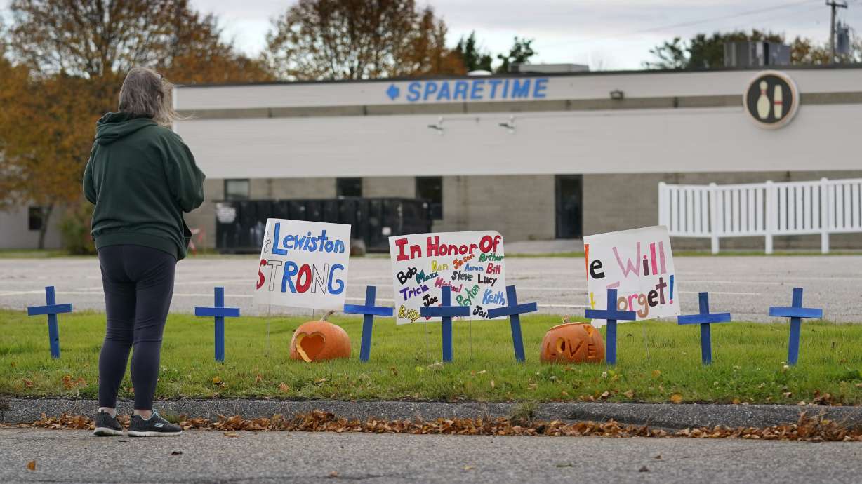 A makeshift memorial outside Sparetime Bowling Alley, one of this week's mass shooting sites, in Lewiston, Maine. The shooter's family expressed concerns about his deteriorating mental health months before the rampage.