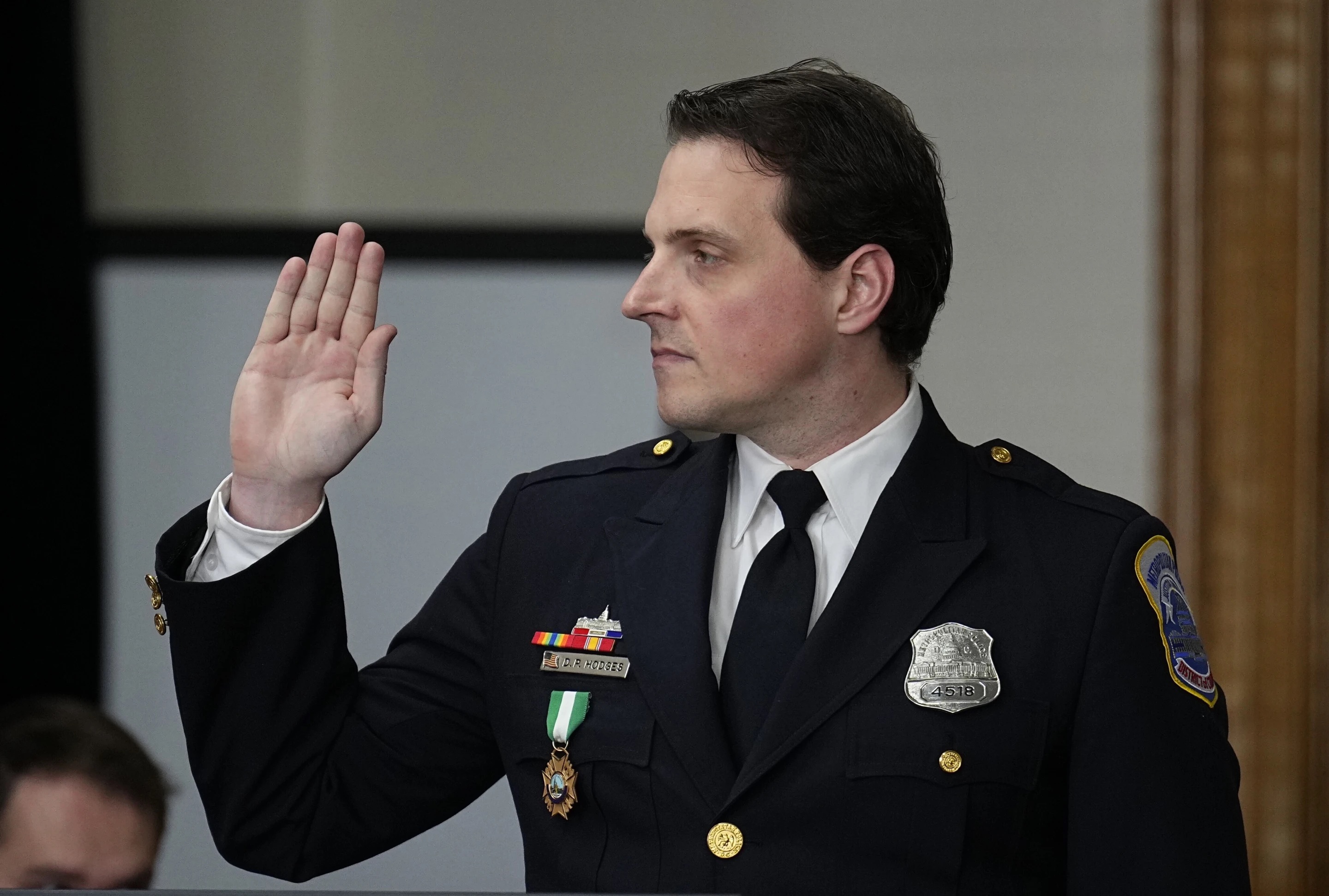 Washington, D.C., Police Department officer Daniel Hodges is sworn in before testifying during a lawsuit to keep former President Donald Trump off the state ballot, in court Monday in Denver.
