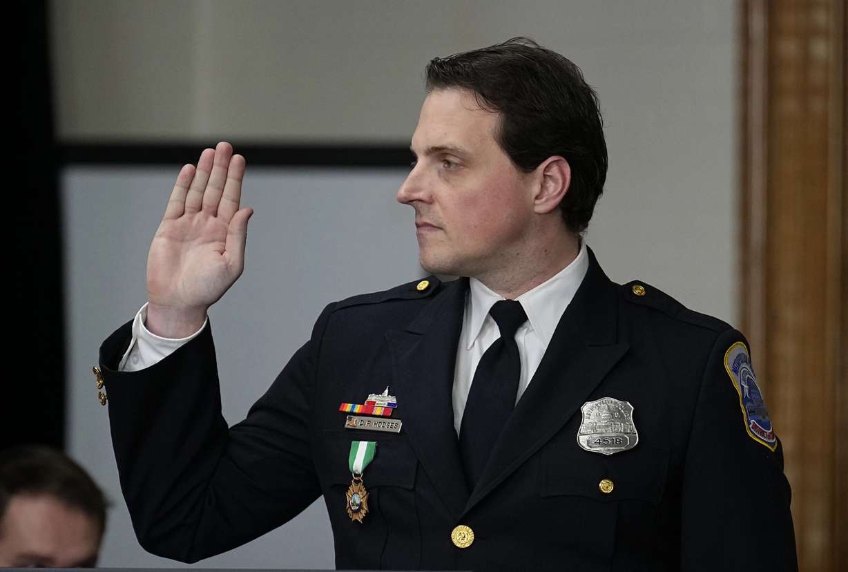 Washington, D.C., Police Department officer Daniel Hodges is sworn in before testifying during a lawsuit to keep former President Donald Trump off the state ballot, in court Monday in Denver.