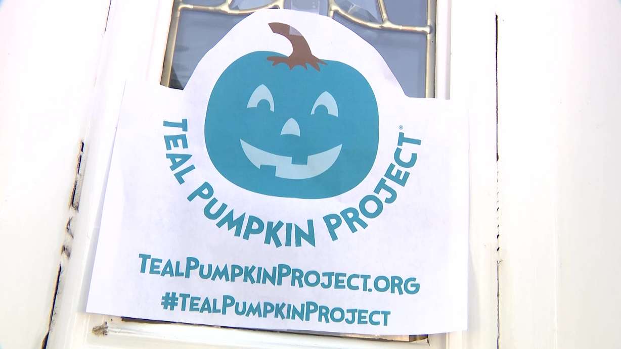 A teal pumpkin on a porch signals to kids with food allergies that the house has safe "treats" for them to have.