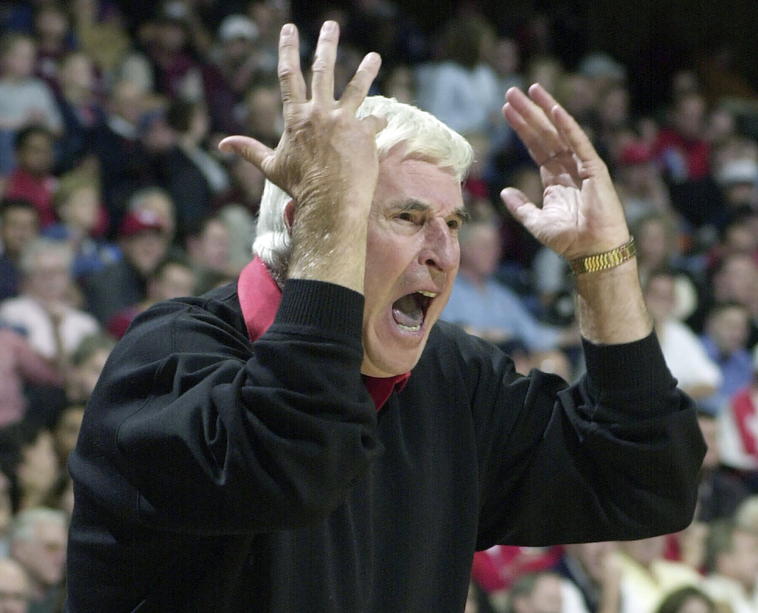 FILE - Texas Tech coach Bob Knight yells from the sideline during the first half of the team's NCAA college basketball game against Houston on Dec. 14, 2001, in Houston. Knight, the brilliant and combustible coach who won three NCAA titles at Indiana and for years was the scowling face of college basketball, has died. He was 83. Knight's family made the announcement on social media on Wednesday night, Nov. 1, 2023, saying he was surrounded by family members at his home in Bloomington, Ind. 