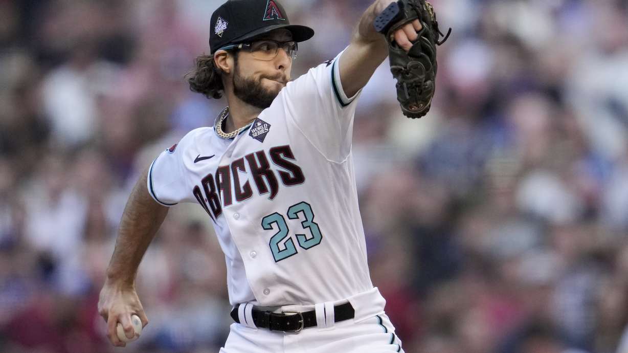 Arizona Diamondbacks starting pitcher Zac Gallen throws against the Texas Rangers during the first inning in Game 5 of the baseball World Series Wednesday, Nov. 1, 2023, in Phoenix.