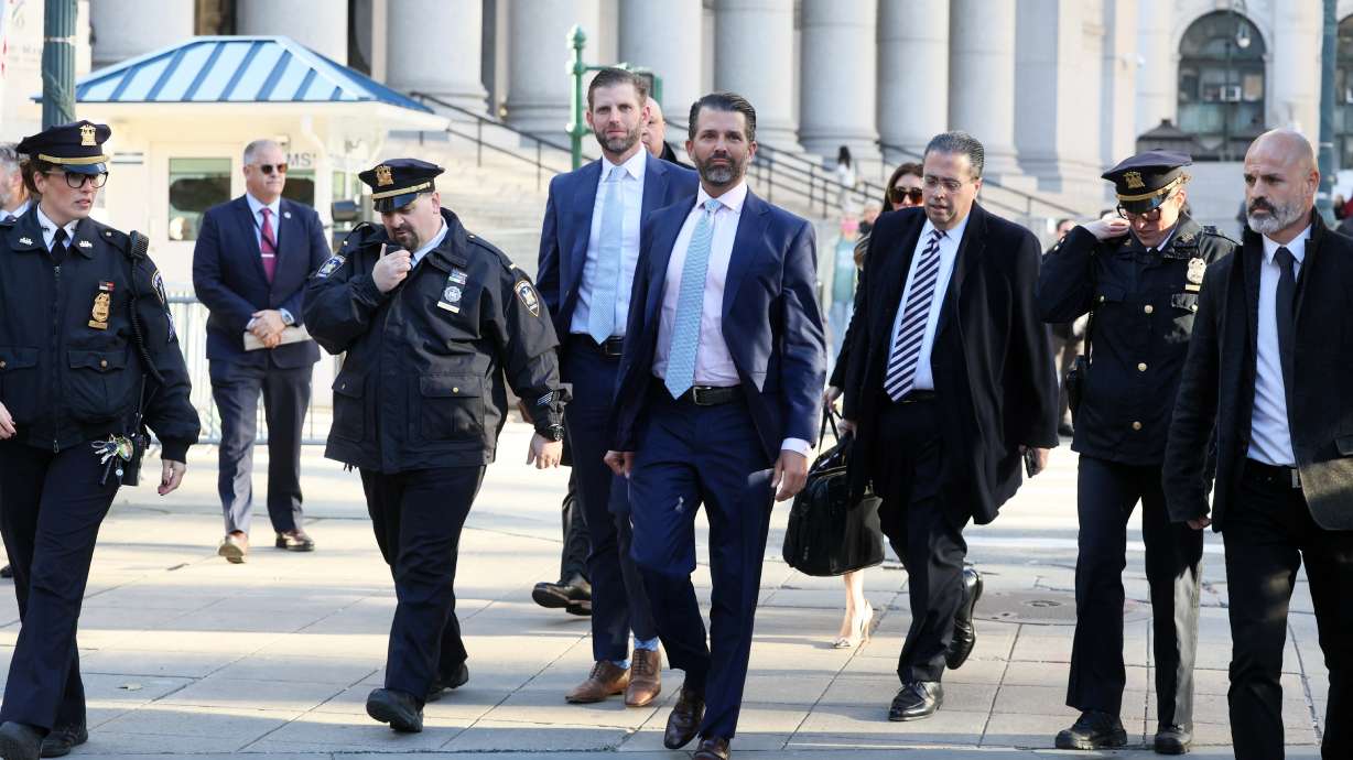 Former U.S. President Donald Trump's sons and co-defendants Donald Trump Jr., and Eric Trump walk to attend the Trump Organization civil fraud trial, in New York State Supreme Court in New York City, Thursday.