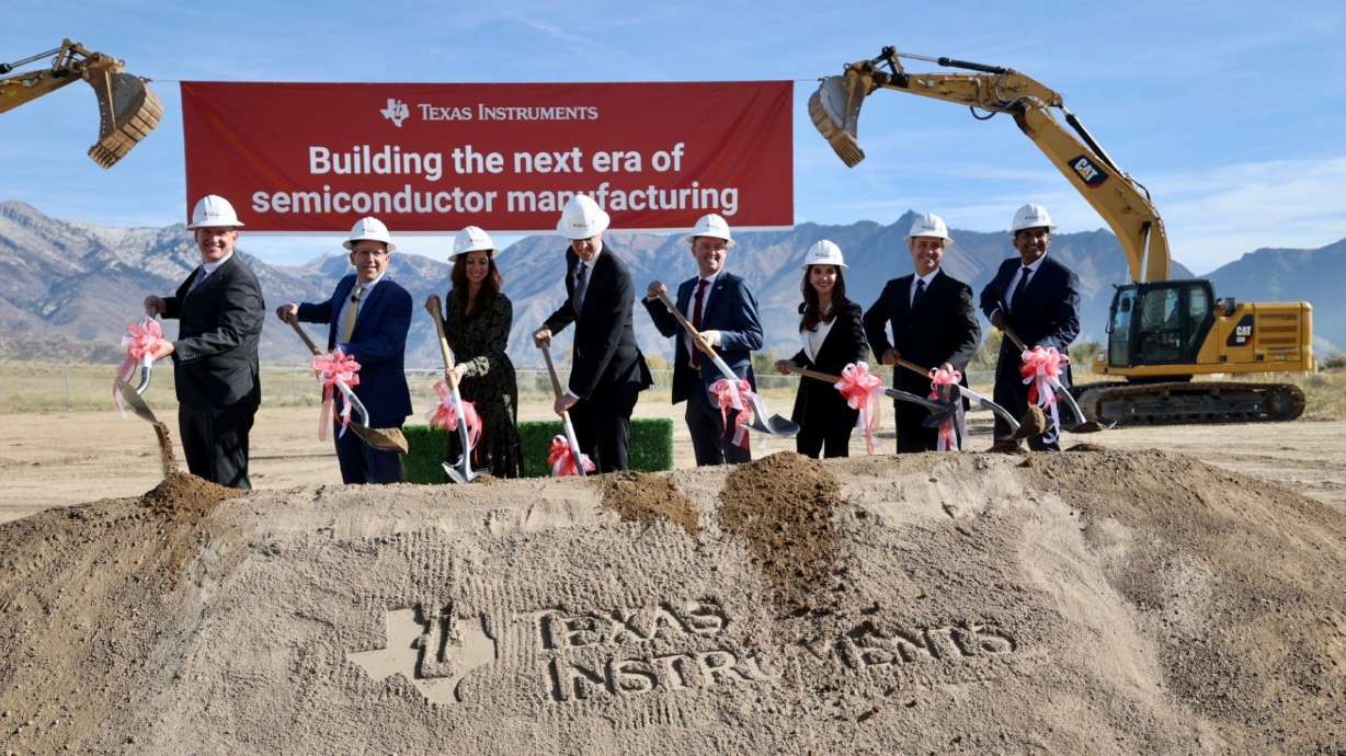Local and state officials at a groundbreaking for a new chip factory in Lehi on Nov. 2, 2023. The Biden administration announced a $1.6 billion investment in Texas Instruments for advanced chip manufacturing plants in Utah and Texas.
