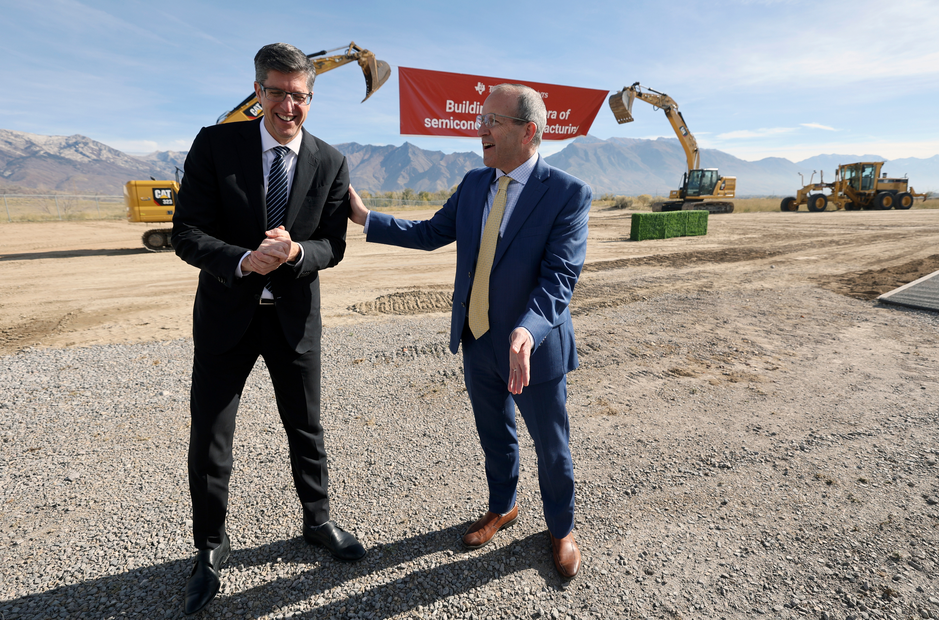 Texas Instruments president and CEO Haviv Ilan talks with Alpine School District superintendent Dr. Shane Farnsworth during a ground breaking ceremony for Texas Instruments’ second Utah semiconductor factory in Lehi on Thursday. Texas Instruments will invest $9 million into the Alpine School District for a K-12 STEM program.