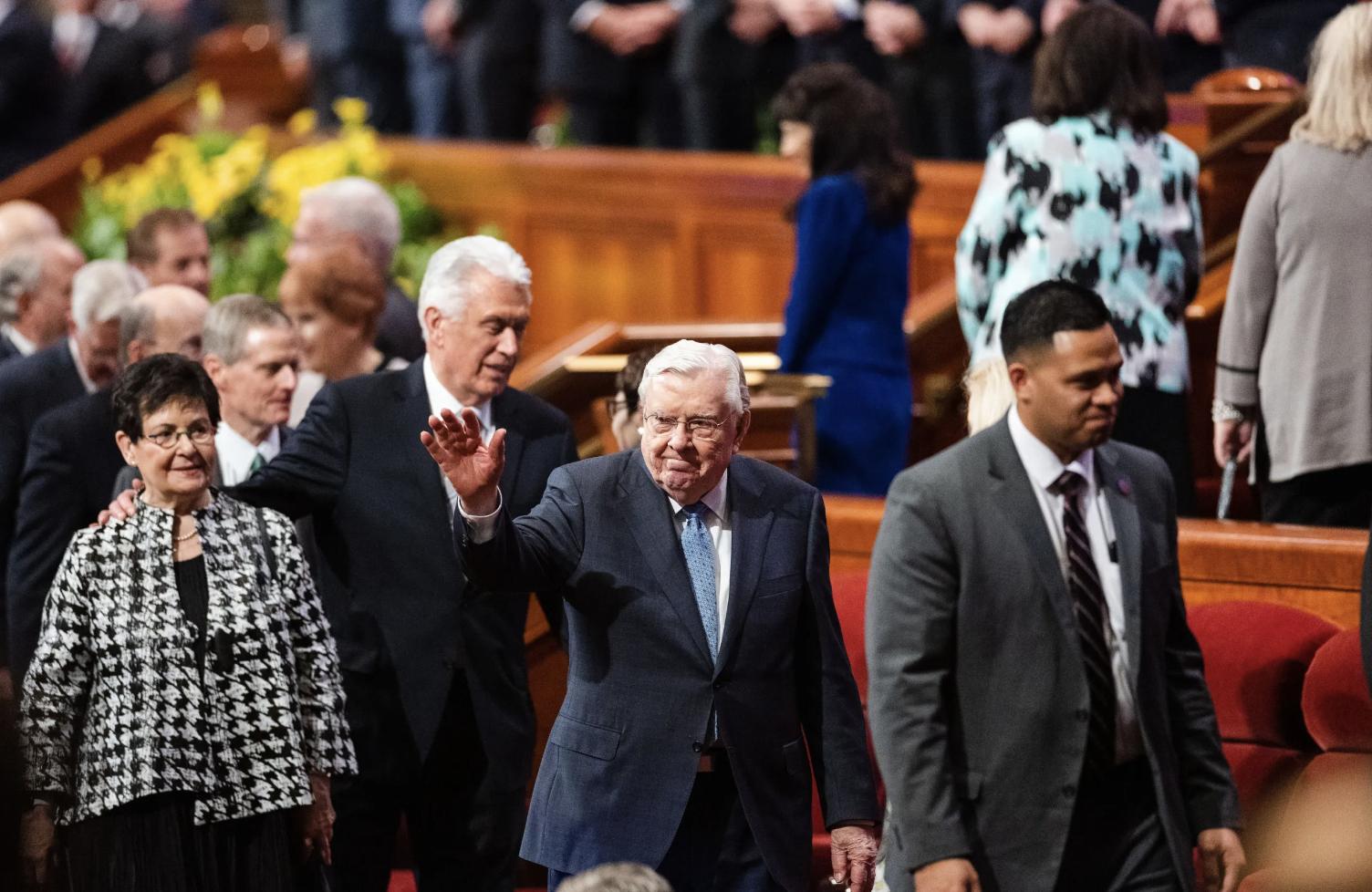 President M. Russell Ballard, acting president of the Quorum of the Twelve Apostles, waves at attendees at the Conference Center in April 2023. The church announced Monday that President Ballard died Sunday night.