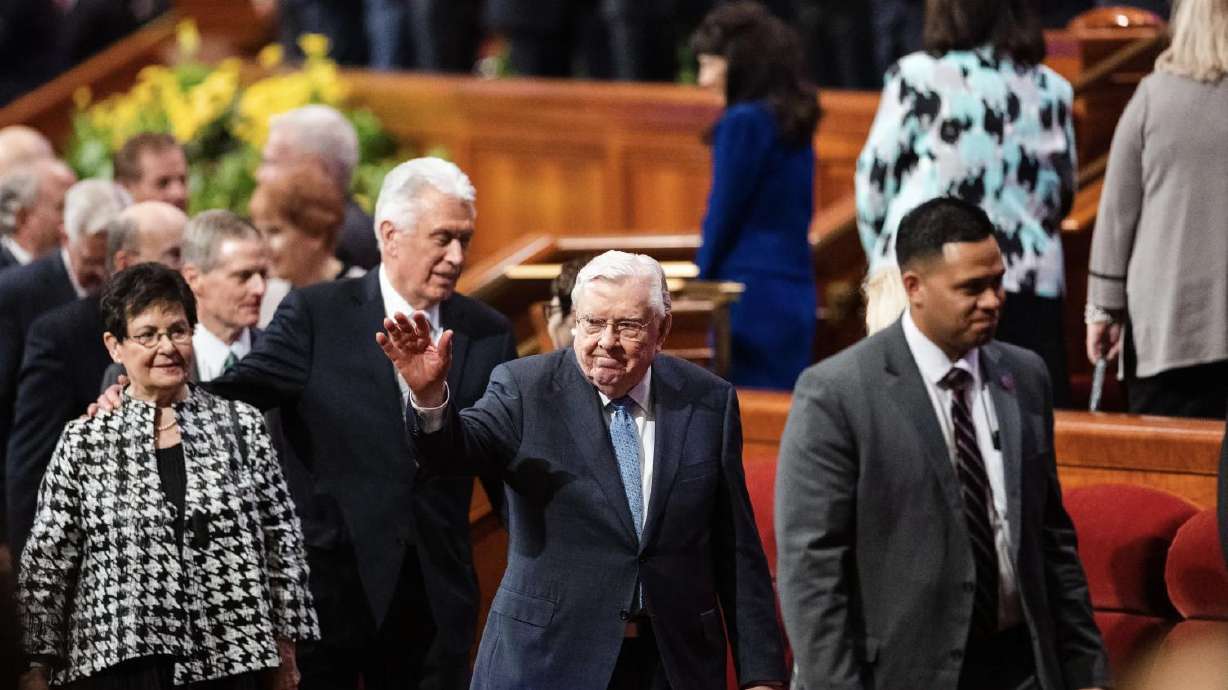 President M. Russell Ballard, acting president of the Quorum of the Twelve Apostles, waves at attendees at the Conference Center in April 2023. President Ballard was recently released from the hospital.