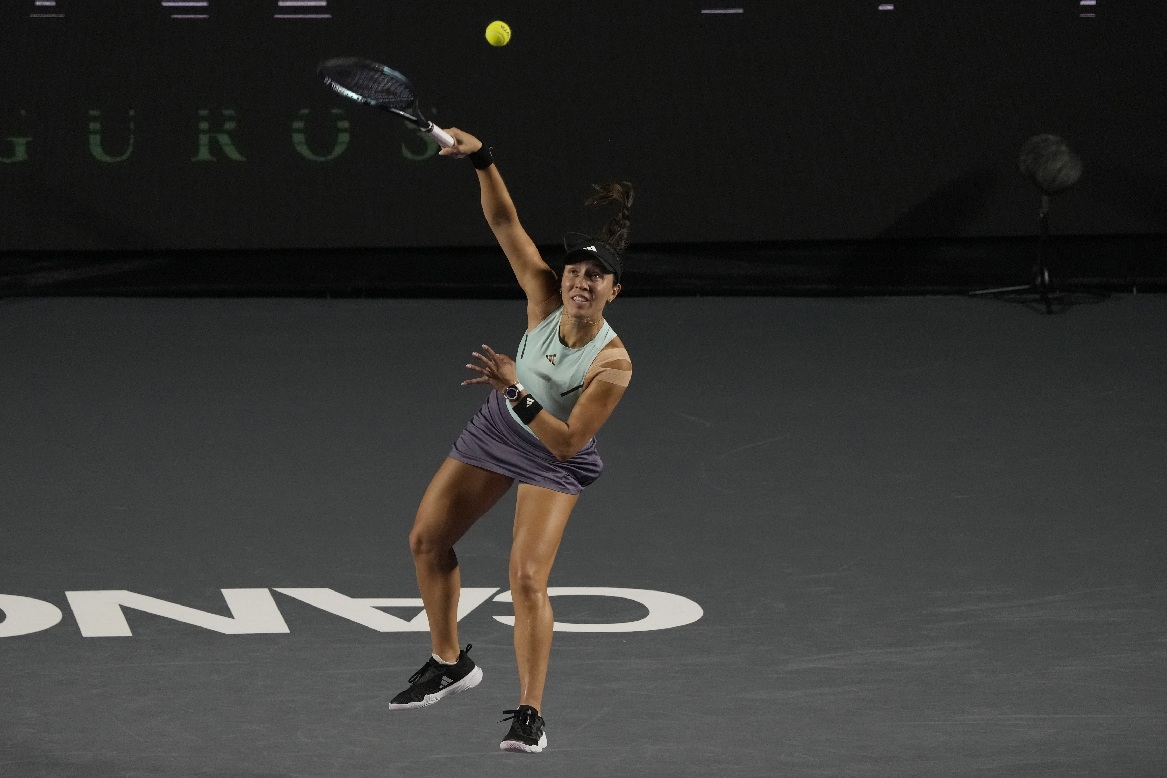 Jessica Pegula of the United States serves against Maria Sakkari of Greece, during a women's singles match at the WTA Finals tennis championships, in Cancun, Mexico, Thursday, Nov. 2, 2023.