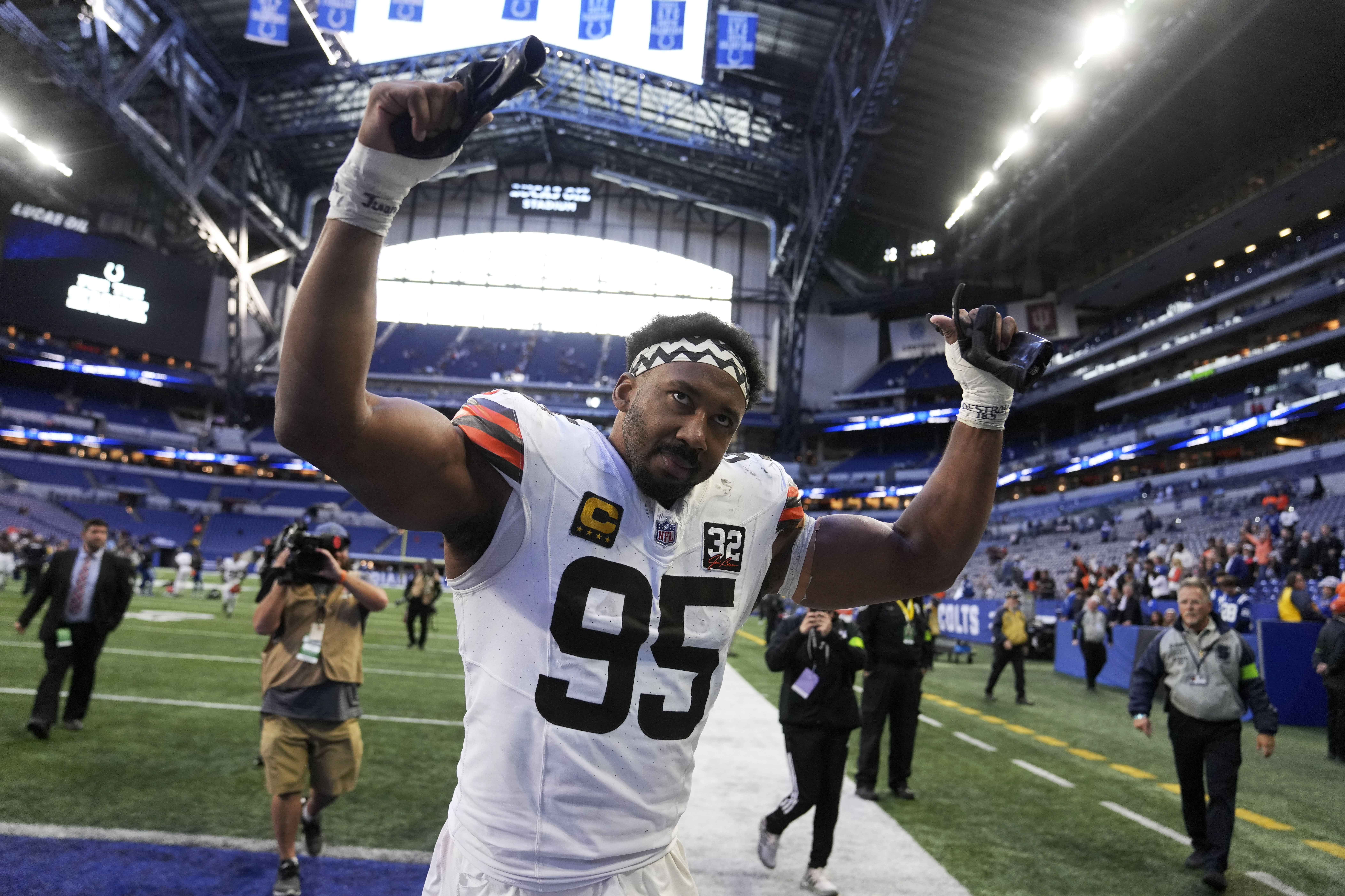 Cleveland Browns defensive end Myles Garrett (95) celebrates as he walks off the field after an NFL football game against the Indianapolis Colts, Sunday, Oct. 22, 2023, in Indianapolis. The Browns won 39-38. 