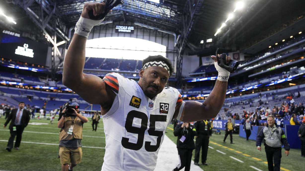 Cleveland Browns defensive end Myles Garrett (95) celebrates as he walks off the field after an NFL football game against the Indianapolis Colts, Sunday, Oct. 22, 2023, in Indianapolis. The Browns won 39-38.