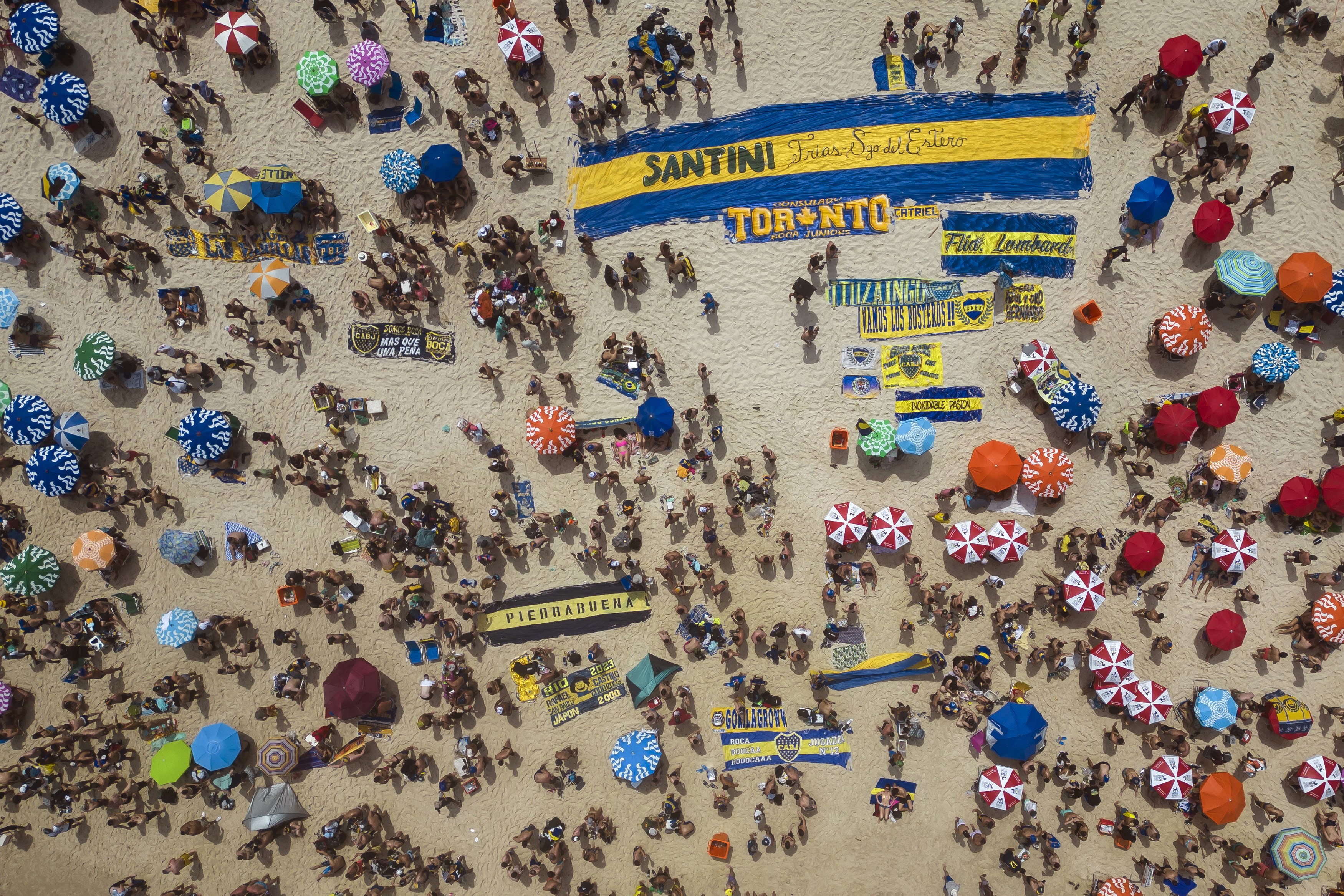 Argentine Boca Juniors fans gather on Copacabana beach the day before their team faces Brazil's Fluminense at the Copa Libertadores championship match in Rio de Janeiro, Brazil, Friday, Nov. 3, 2023. 