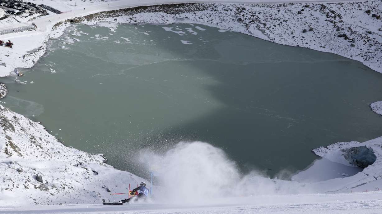 United States' Tommy Ford speeds down the course during the first run of an alpine ski, men's World Cup giant slalom race, in Soelden, Austria, Sunday, Oct. 29, 2023. In the background the Rettenbach glacier.