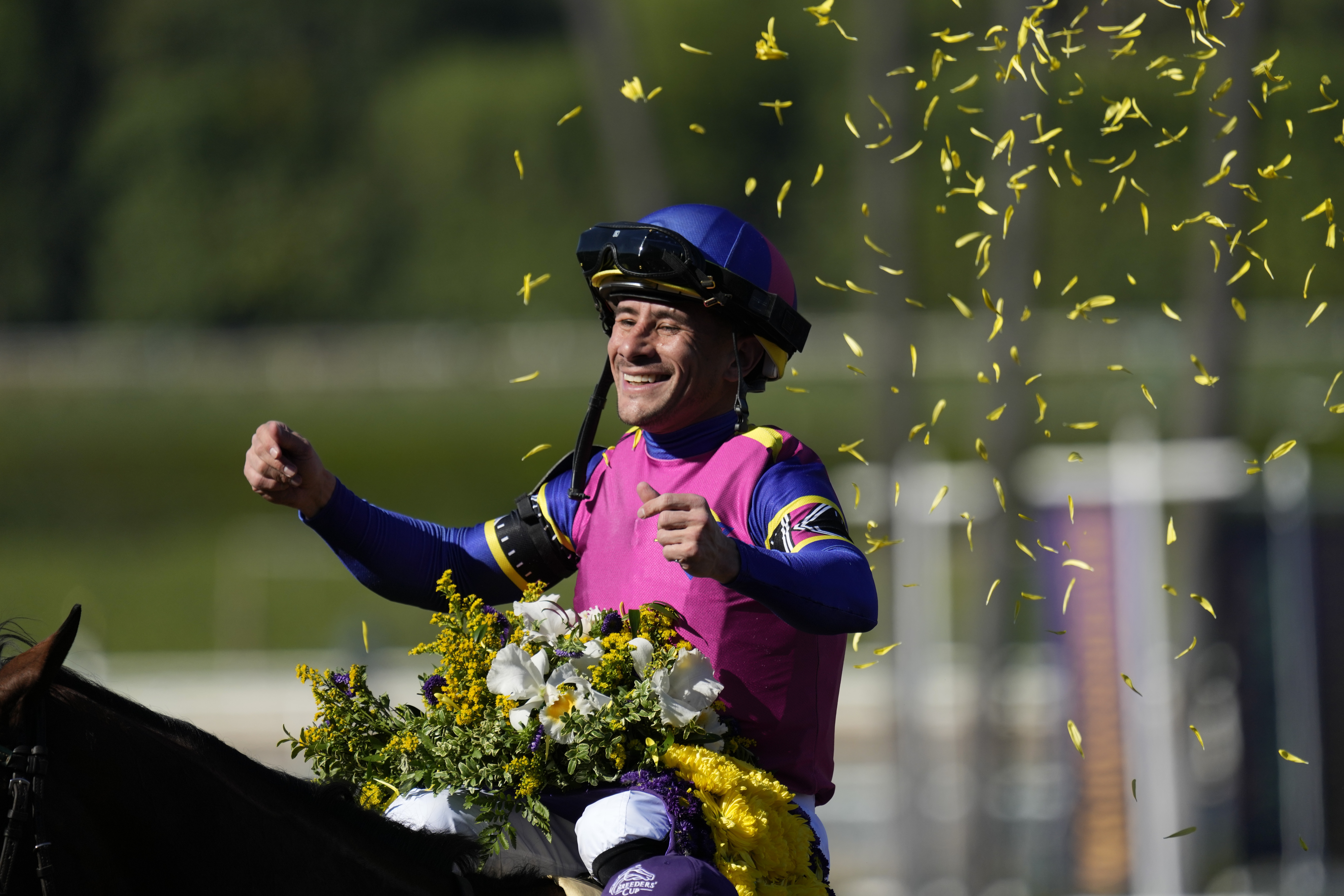 Junior Alvarado celebrates atop Just FYI after winning the Breeders' Cup Juvenile Fillies horse race Friday, Nov. 3, 2023 at Santa Anita Park in Arcadia, Calif.