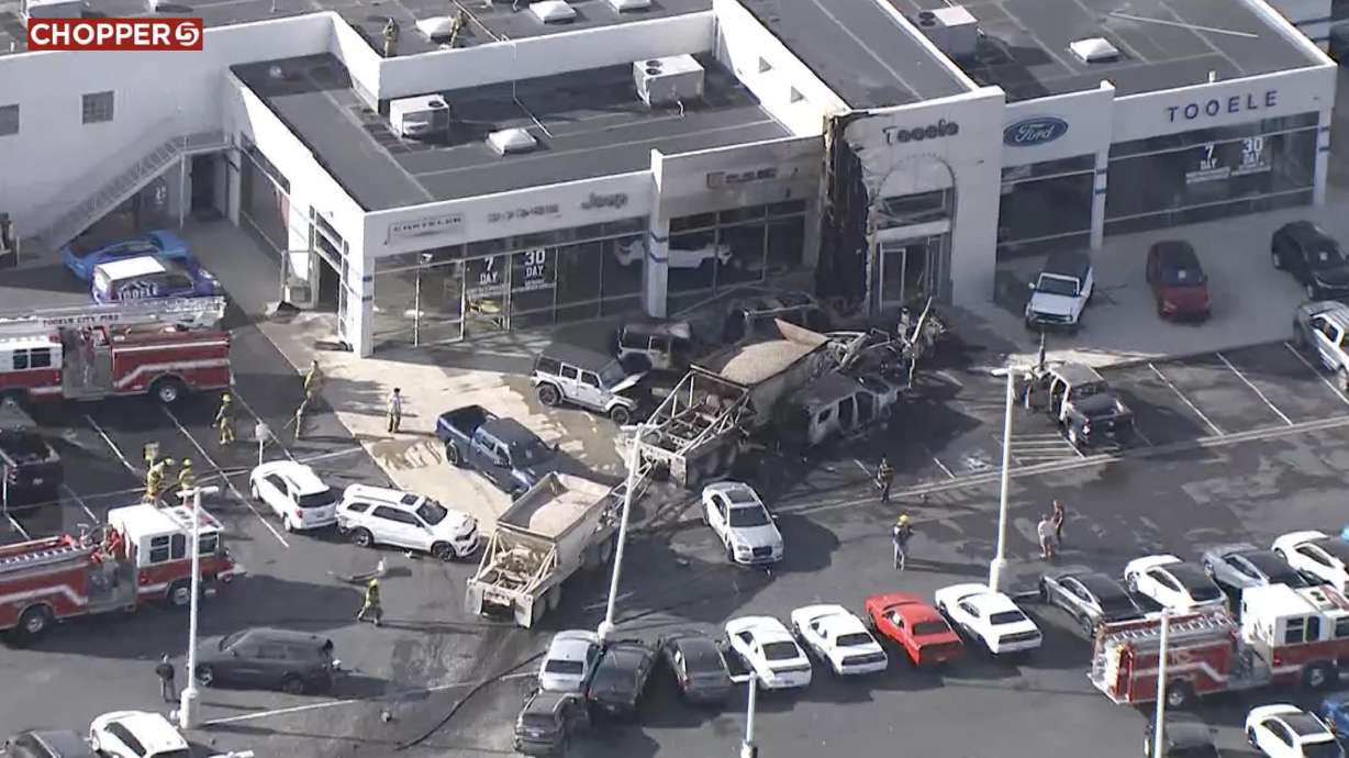 The Tooele Auto Mall caught fire and several people were injured after a semitruck crashed into several vehicles and the auto mall building in Tooele on Nov. 3, 2023. The driver of a semi is now facing a misdemeanor charge.