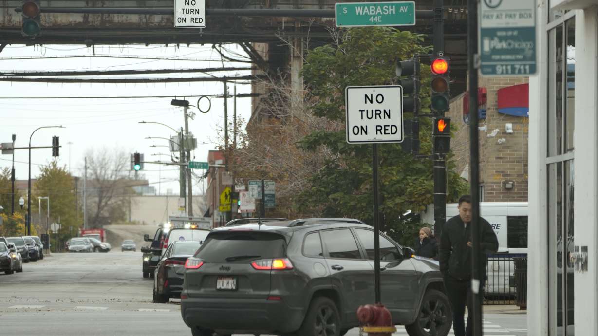 A vehicle makes a right turn on red prohibited intersection the turn Oct. 31, in Chicago. Moves to ban right turns on red have drawn some of the most intense sentiments on both sides.