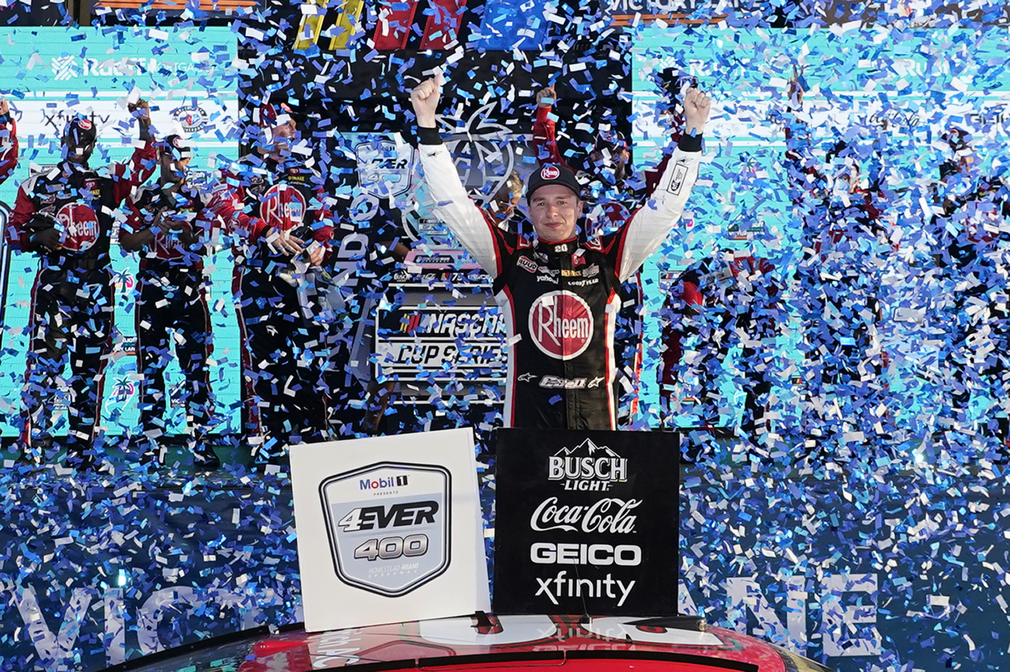 Christopher Bell, center, celebrates after winning a NASCAR Cup Series auto race at Homestead-Miami Speedway, Sunday, Oct. 22, 2023, in Homestead, Fla. 