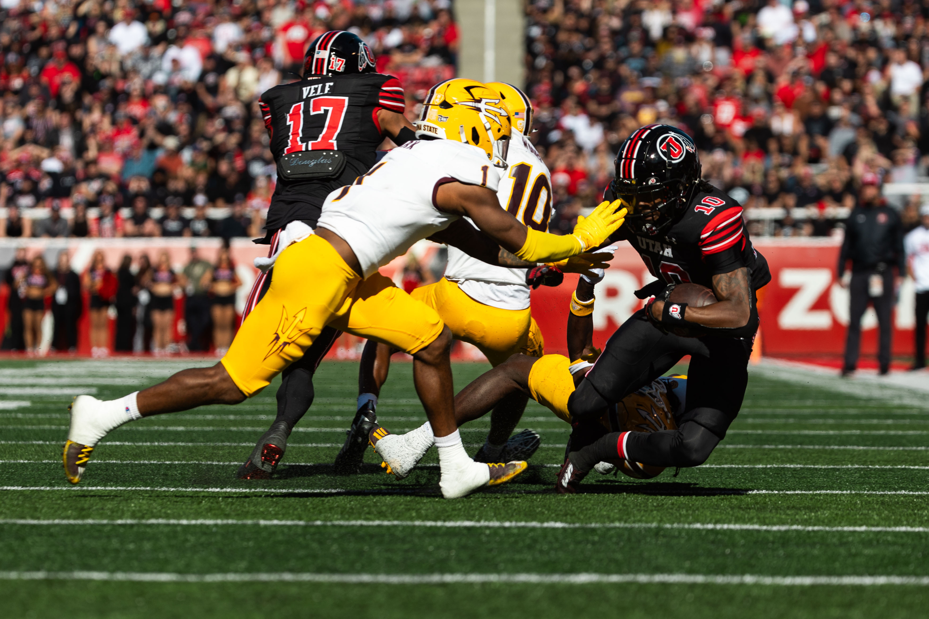 Utah Utes wide receiver Money Parks runs the ball with Arizona State Sun Devils defensive back Jordan Clark on defense during the game at Rice-Eccles Stadium in Salt Lake City on Saturday, Nov. 4, 2023.