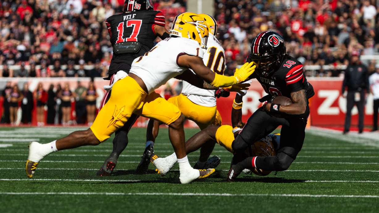 Utah Utes wide receiver Money Parks runs the ball with Arizona State Sun Devils defensive back Jordan Clark on defense during the game at Rice-Eccles Stadium in Salt Lake City on Saturday, Nov. 4, 2023.