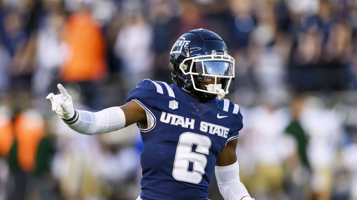 Utah State safety Ike Larsen (6) motions to teammates on defense during an NCAA football game on Saturday, Oct. 7, 2023 in Logan, Utah.